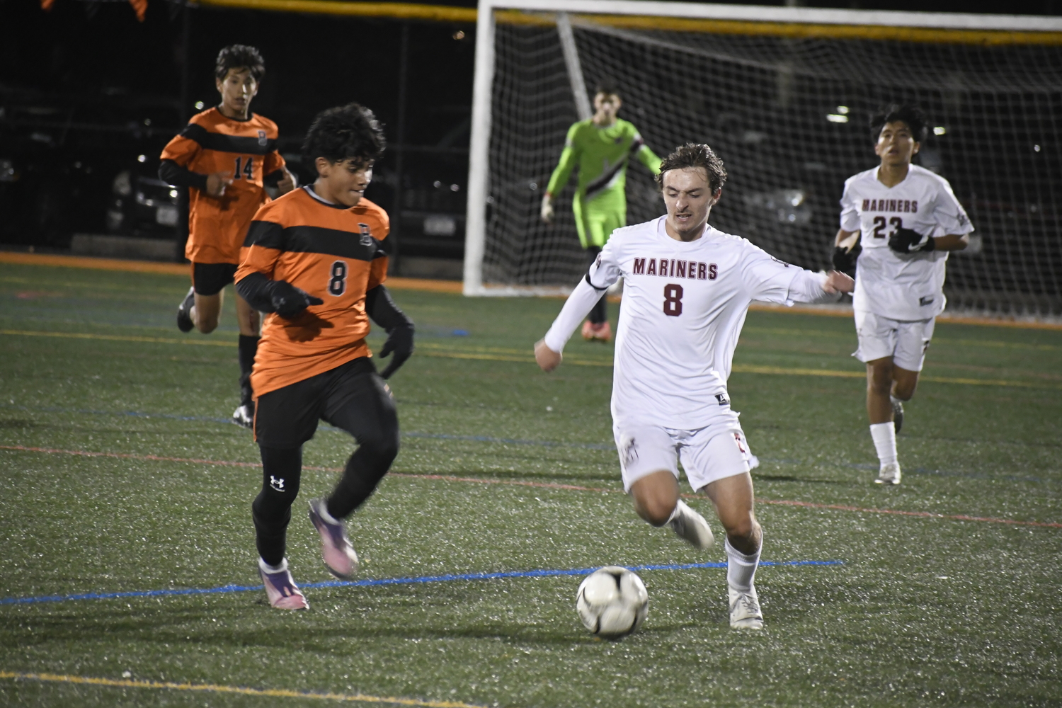Southampton junior co-captain Max Mobius goes to flick the ball ahead with Babylon sophomore Edwin Orellana incoming.  DREW BUDD