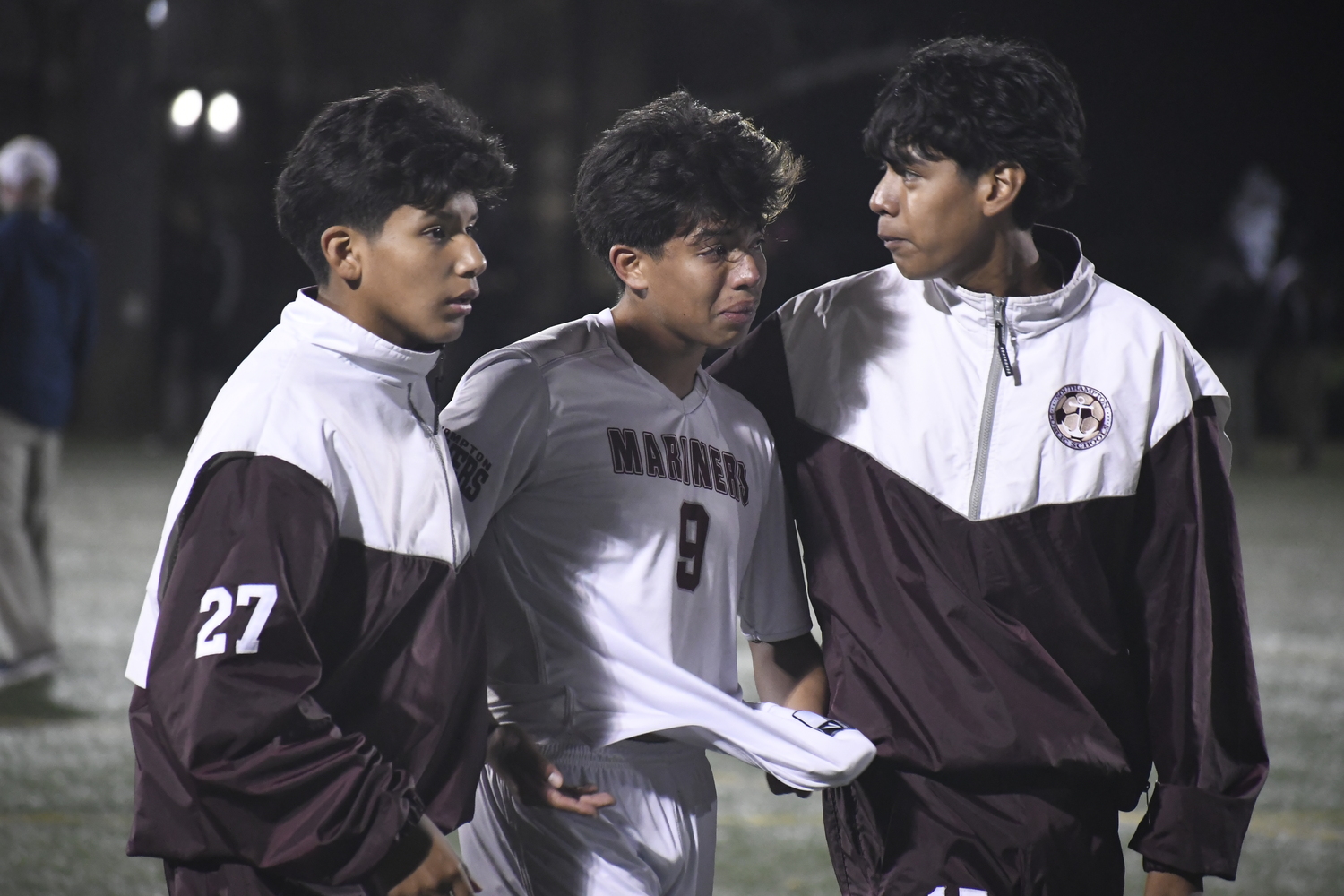 Teammate console Gonzalo Alvarez after the final whistle in the Mariners' 4-1 loss at Babylon on October 29.  DREW BUDD