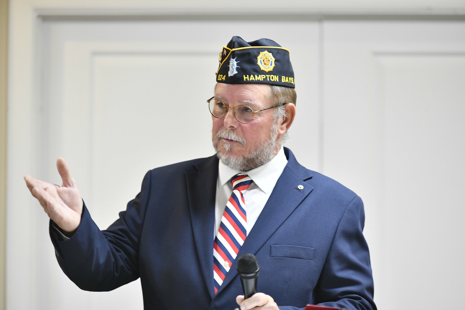 Hampton Bays American Legion Hand Aldrich Post 924 Commander George Hand welcomes the crowd to the Veterans Day ceremony on Tuesday.