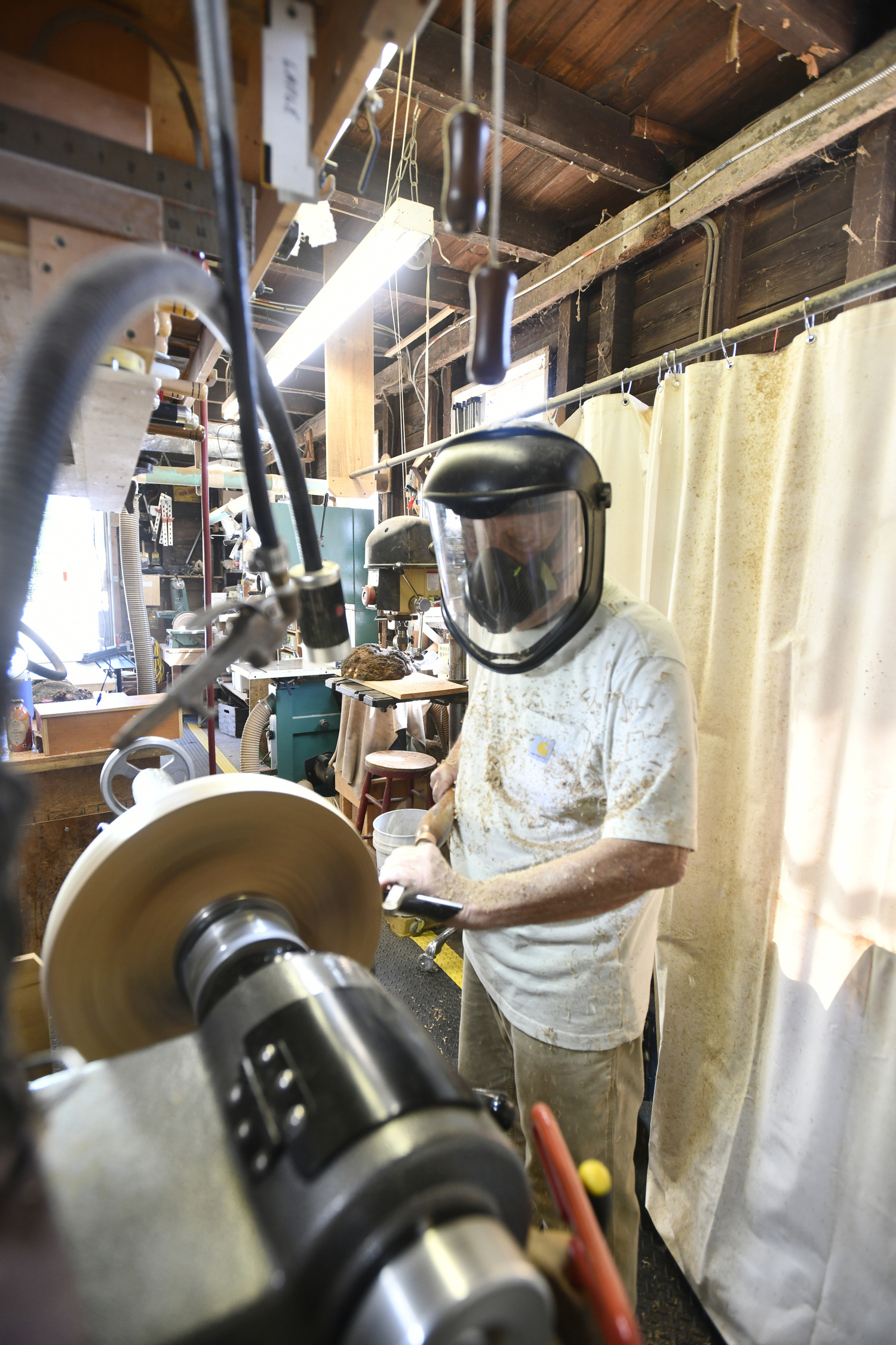Woodturning is a messy but rewarding endeavor for John Halsey, who joked that he got an 'F' in retirement. DANA SHAW
