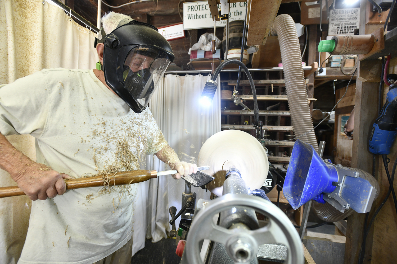 Woodturning is a messy but rewarding endeavor for John Halsey, who joked that he got an 'F' in retirement. DANA SHAWDANA SHAW