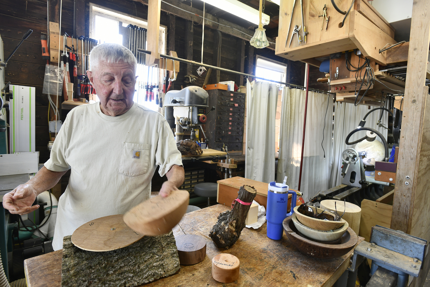 John Halsey at work in his shop, where he has discovered a passion for woodturning. DANA SHAW