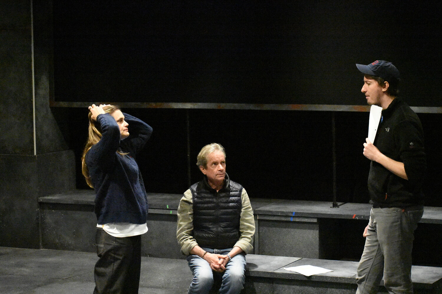 Actors Daniela Mastropietro and John Kroft, standing, work with director Stephen Hamilton during rehearsals of 