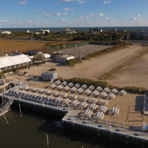 The owner of Dockers Waterside restaurant on Dune Road in East Quogue has proposed tearing down the restaurant and building 25 townhouse condominiums. Neighbors and environmentalists have pleaded with Southampton Town to reject the proposal and purchase the land with preservation funds.