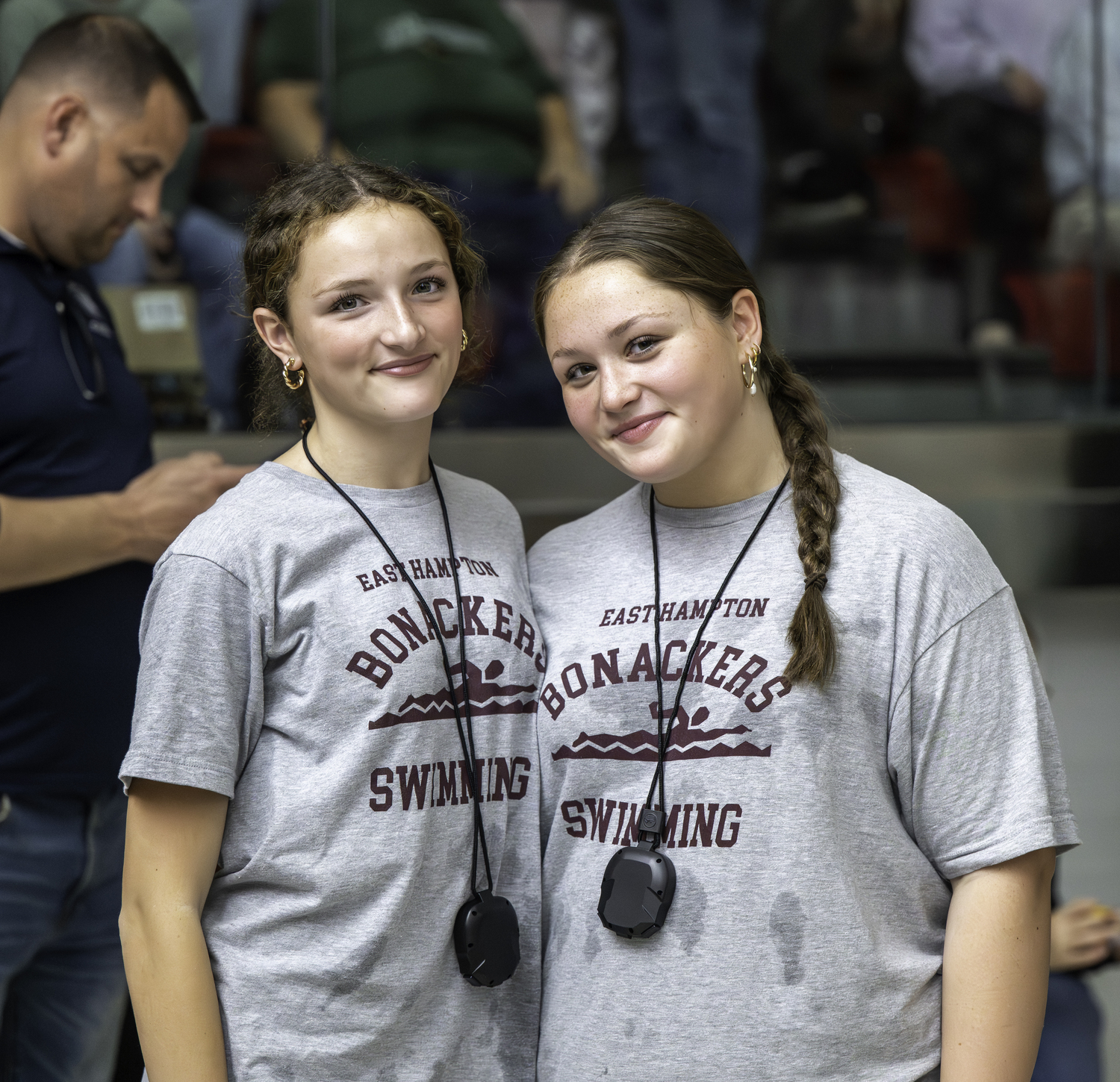 Bonackers Olivia Robertson, left, and Kate Daleski supporting their teammates at Stony Brook University on Sunday.  MARIANNE BARNETT