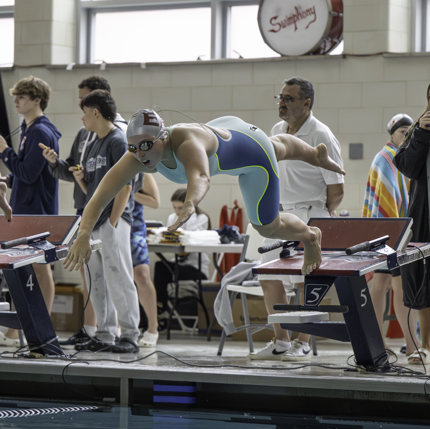 Lizzy Daniels dives into the pool for the start of the 200-yard individual medley.  MARIANNE BARNETT