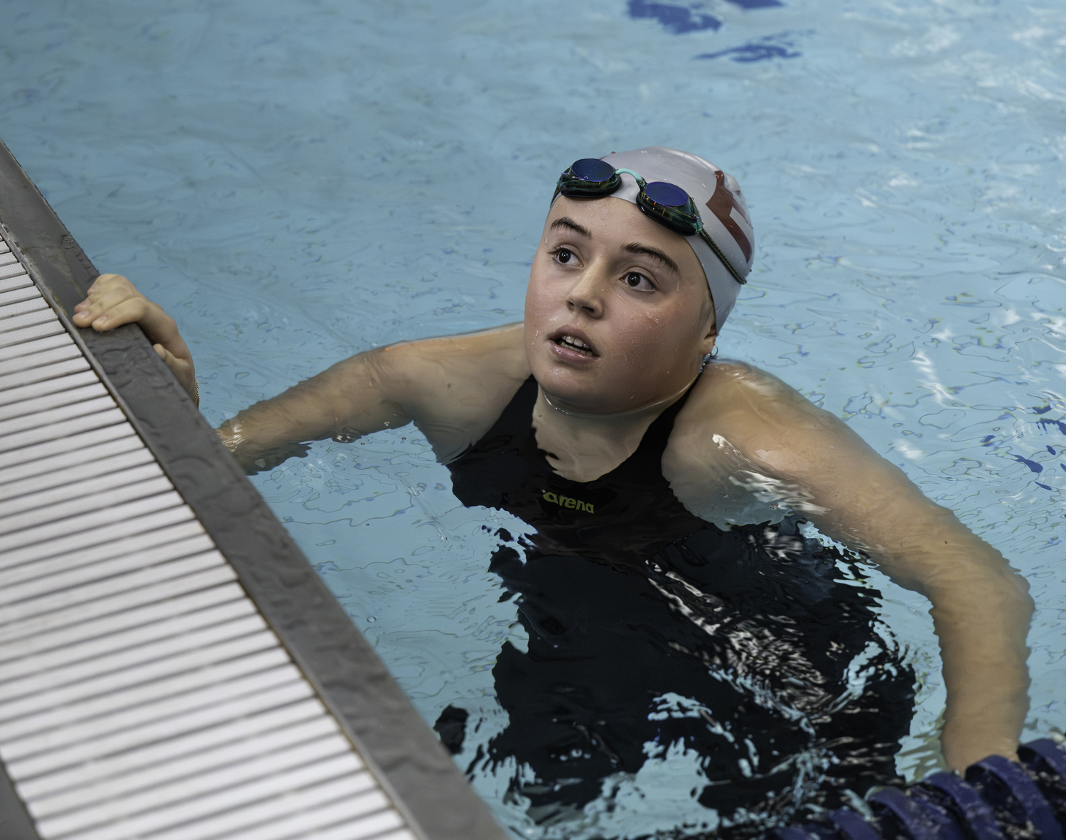 Ginger Griffin checks her time in the 100-yard butterfly.  MARIANNE BARNETT