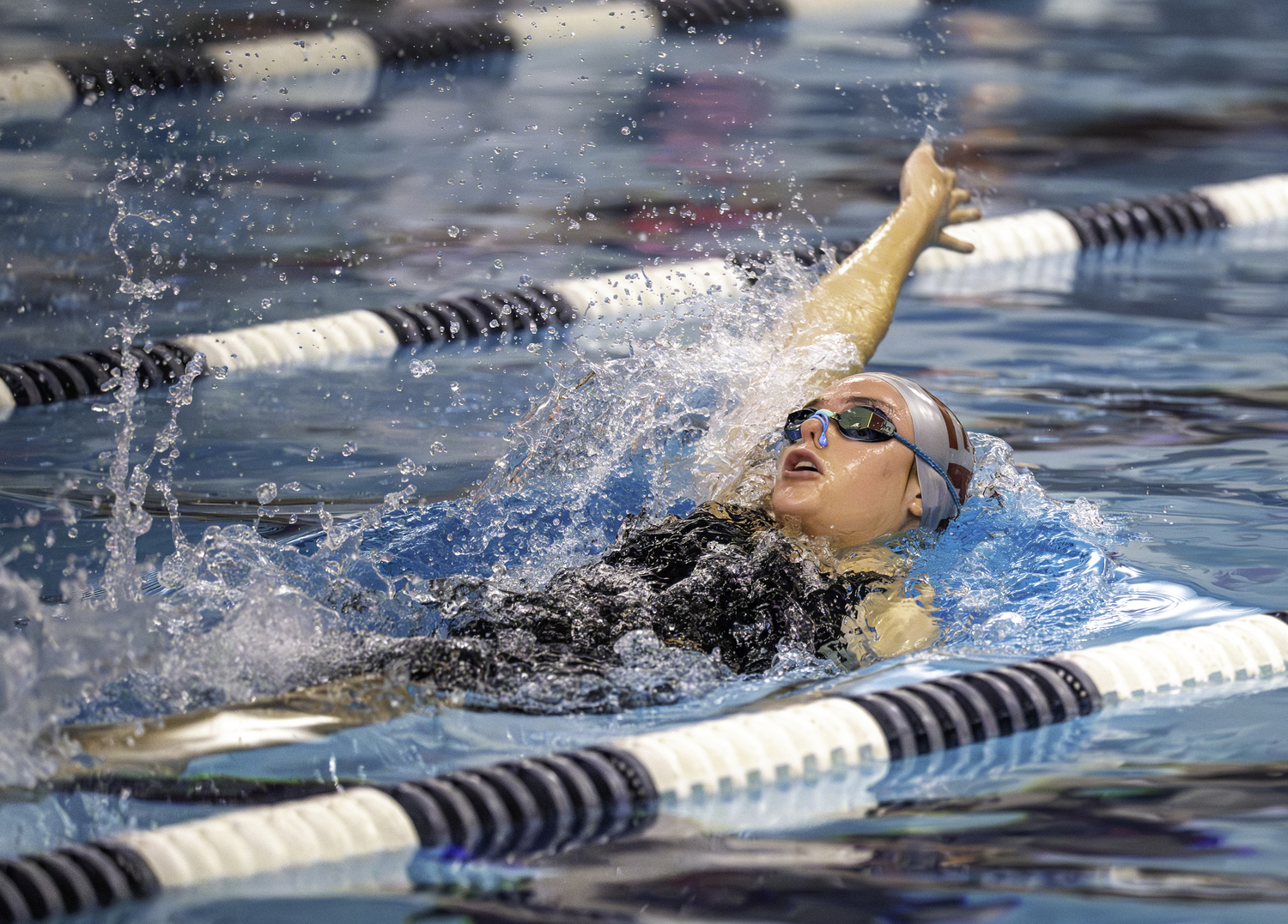 Vanessa Rizzo competes in the 100-yard backstroke.  MARIANNE BARNETT