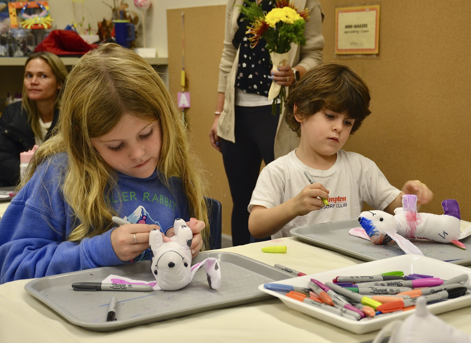 Sloane and Mason Snyder decorate a stuffed dogs at the ARF (Animal Rescue Fund) Hamptons community event at the Shine Studio in Bridgehampton on Sunday afternoon.  KYRIL BROMLEY