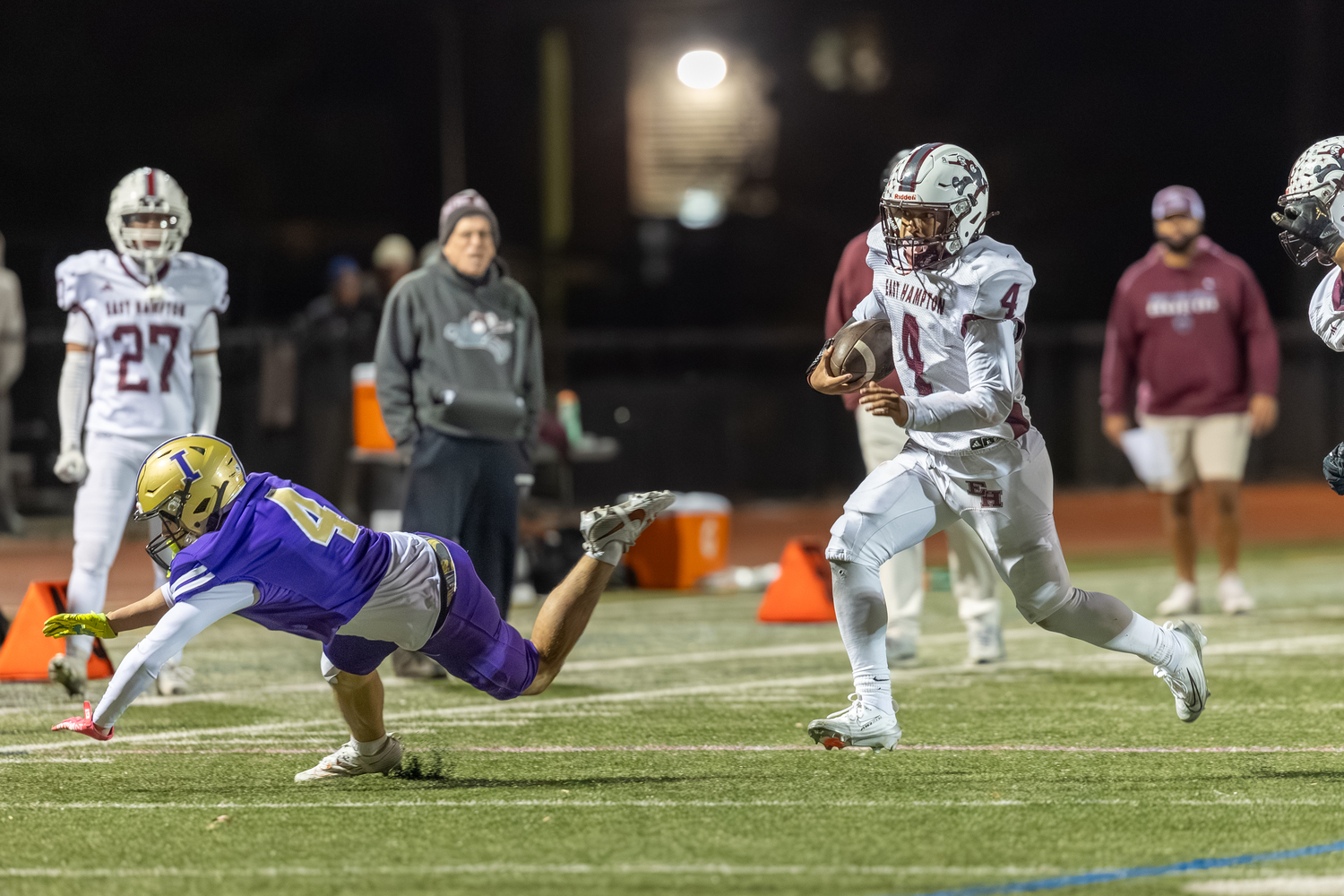East Hampton junior Jackson Ronick takes advantage of an Islip defender going down to gain some yards.  RON ESPOSITO