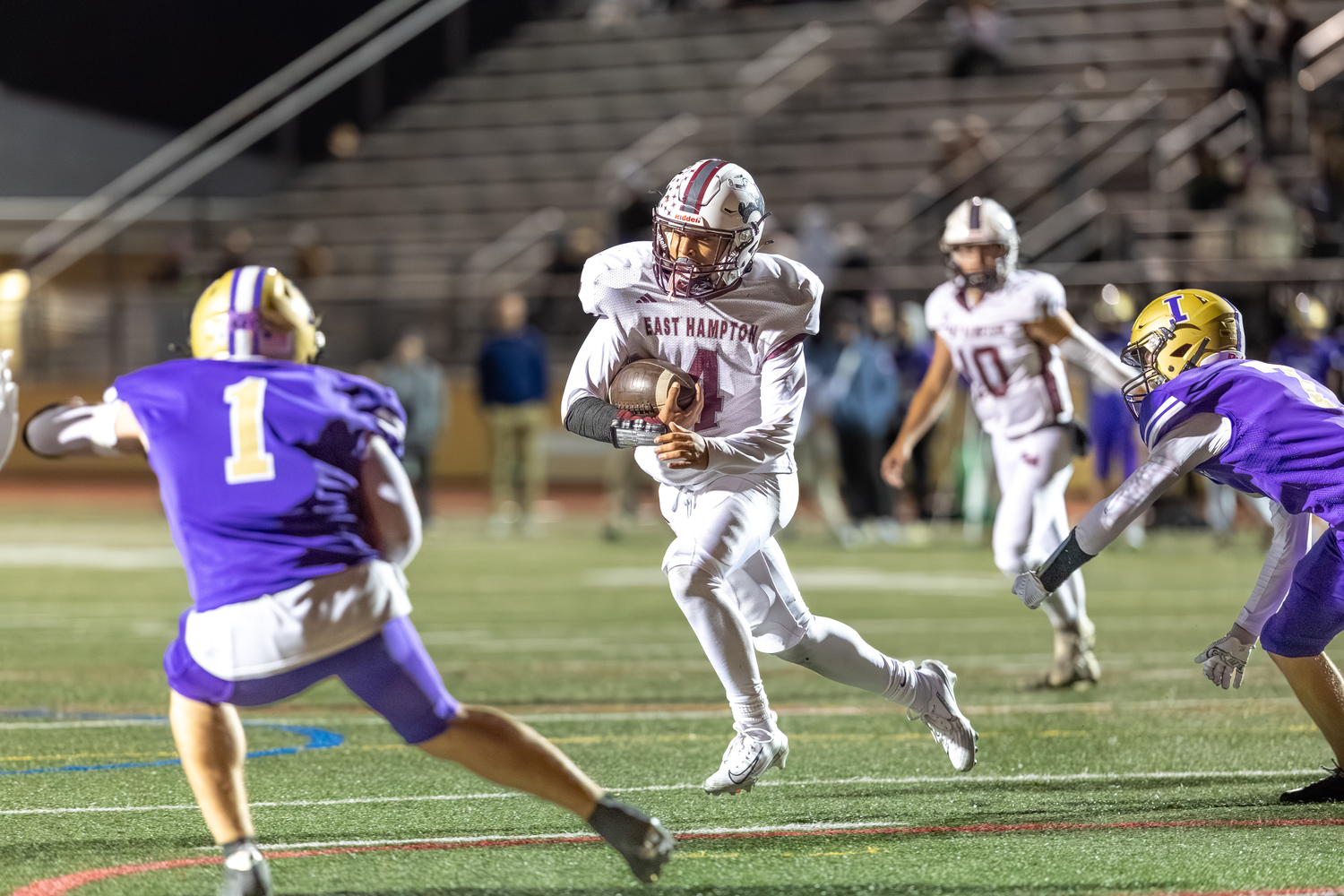 East Hampton junior Jackson Ronick takes advantage of an Islip defender going down to gain some yards.  RON ESPOSITO