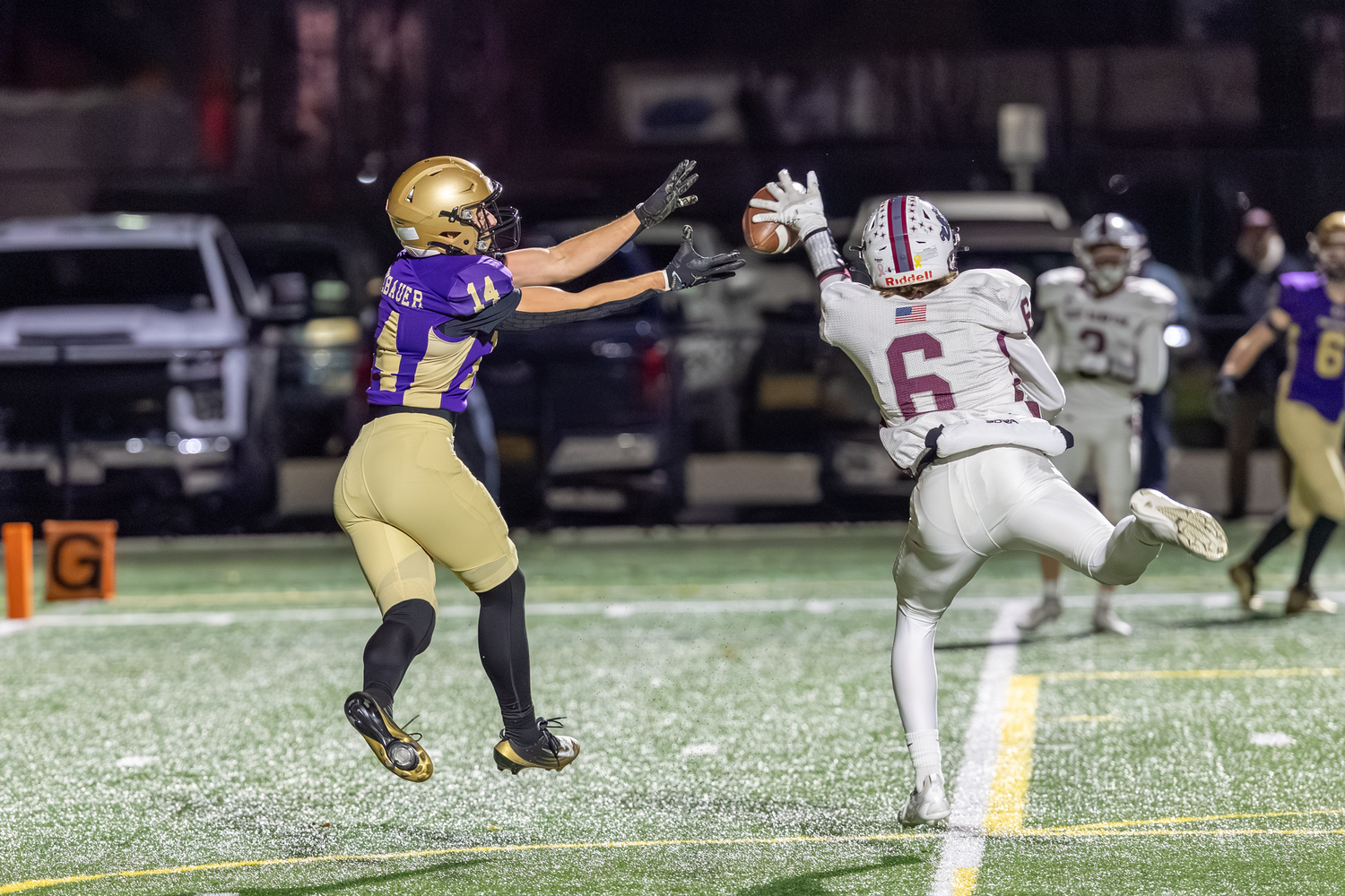 East Hampton's Livs Kuplins comes up big on defense, deflecting a pass intended for Sayville's Luke Neugebauer in the end zone.  RON ESPOSITO