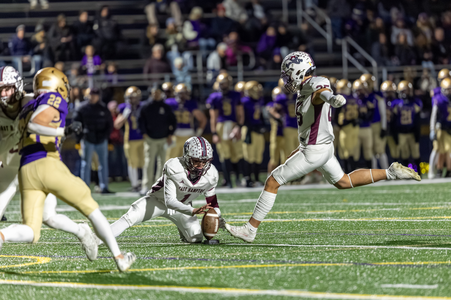 East Hampton senior Manny Morales kicks an extra point on Friday night.  RON ESPOSITO