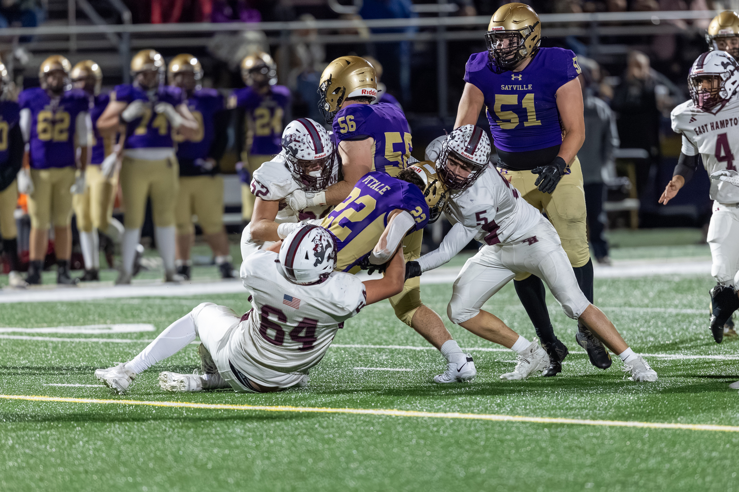 Bonackers Jake Rivera (52), Tiger Brew (64) and Jackson Ronick (5) tackle Sayville's Tristan Vitale. RON ESPOSITO