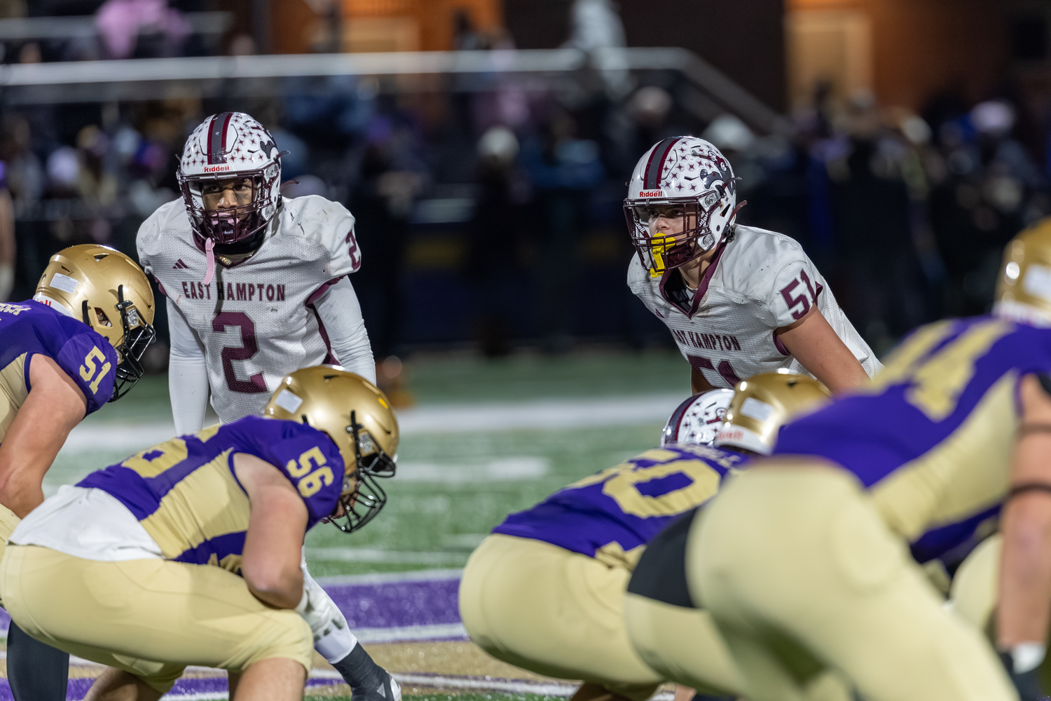 Seniors Jai Feaster, left, and James Corwin peer in on the Sayville offense.  RON ESPOSITO
