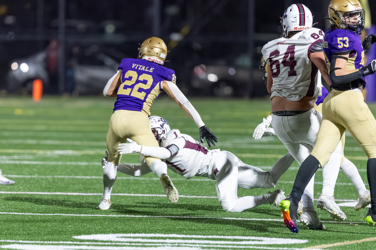 East Hampton senior Cole Dunchick tackles Sayville's Tristan Vitale.  RON ESPOSITO