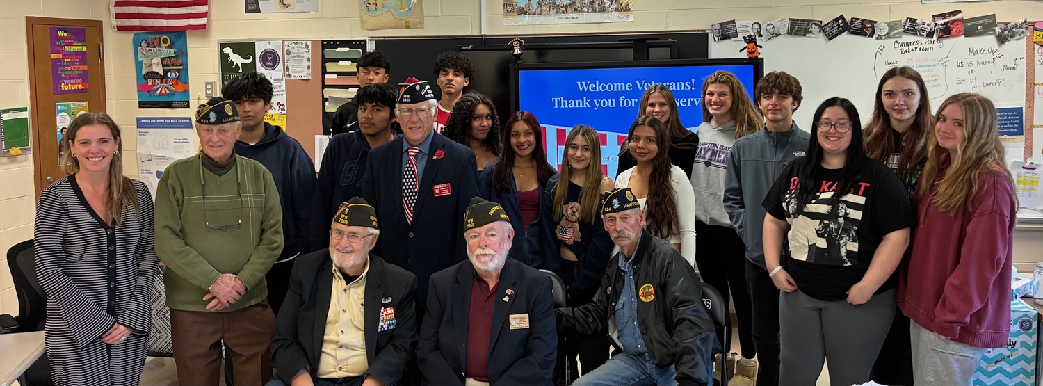 Members of the Veterans of Foreign Wars Post 5350 and American Legion Post 924 recently visited Hampton Bays High School to speak to social studies students about the annual Voice of Democracy essay contest and share powerful accounts of their experiences serving in different branches of the U.S. military. They spoke about the significance of service to one’s school, community and country and encouraged students to consider the many ways they can make a difference. The visit included a question-and- answer session, allowing students to engage directly with local heroes. COURTESY HAMPTON BAYS SCHOOL DISTRICT