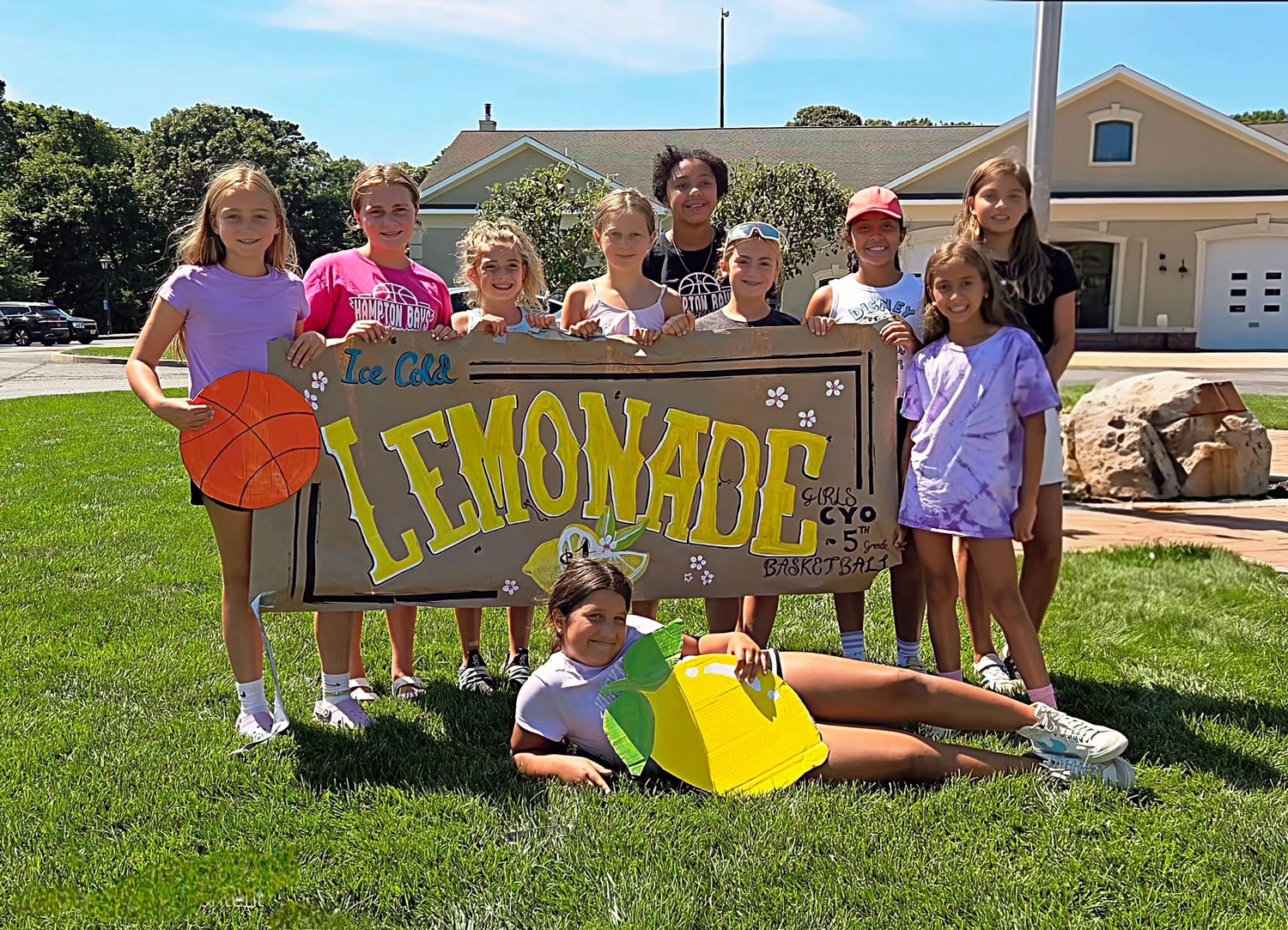The girls had fun setting up a lemonade stand this past summer where they raised over $1,400 for brand new uniforms and future items.  COURTESY ANTHONY SIDERATOS