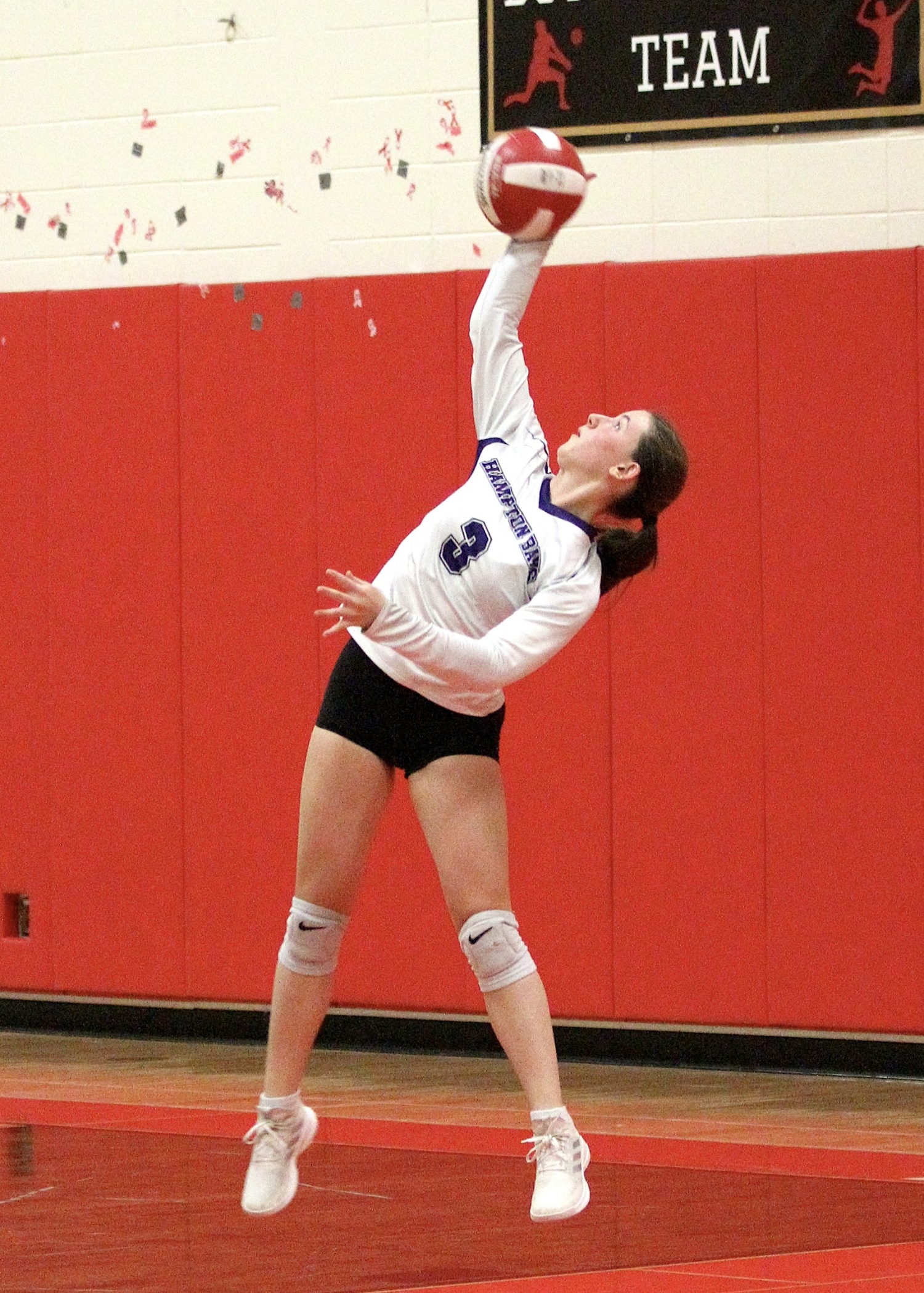 Senior libero Lilly Maffia serves. DESIRÉE KEEGAN