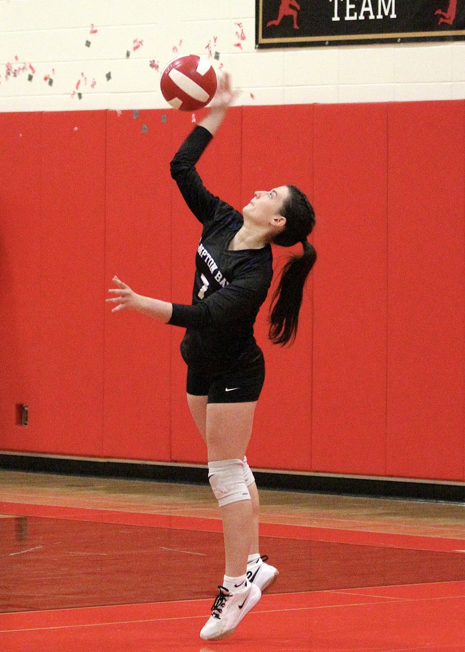 Sophomore outside hitter Lorelei Palmieri serves. DESIRÉE KEEGAN