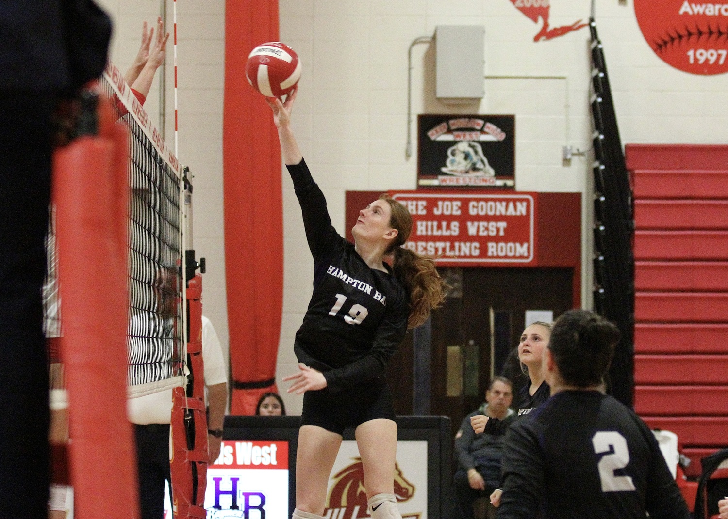 Senior middle blocker Shea Egan pushes the ball over over the net. DESIRÉE KEEGAN