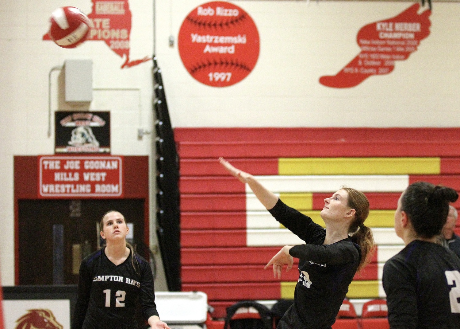 Senior middle blocker Shea Egan sends the ball over the net. DESIRÉE KEEGAN