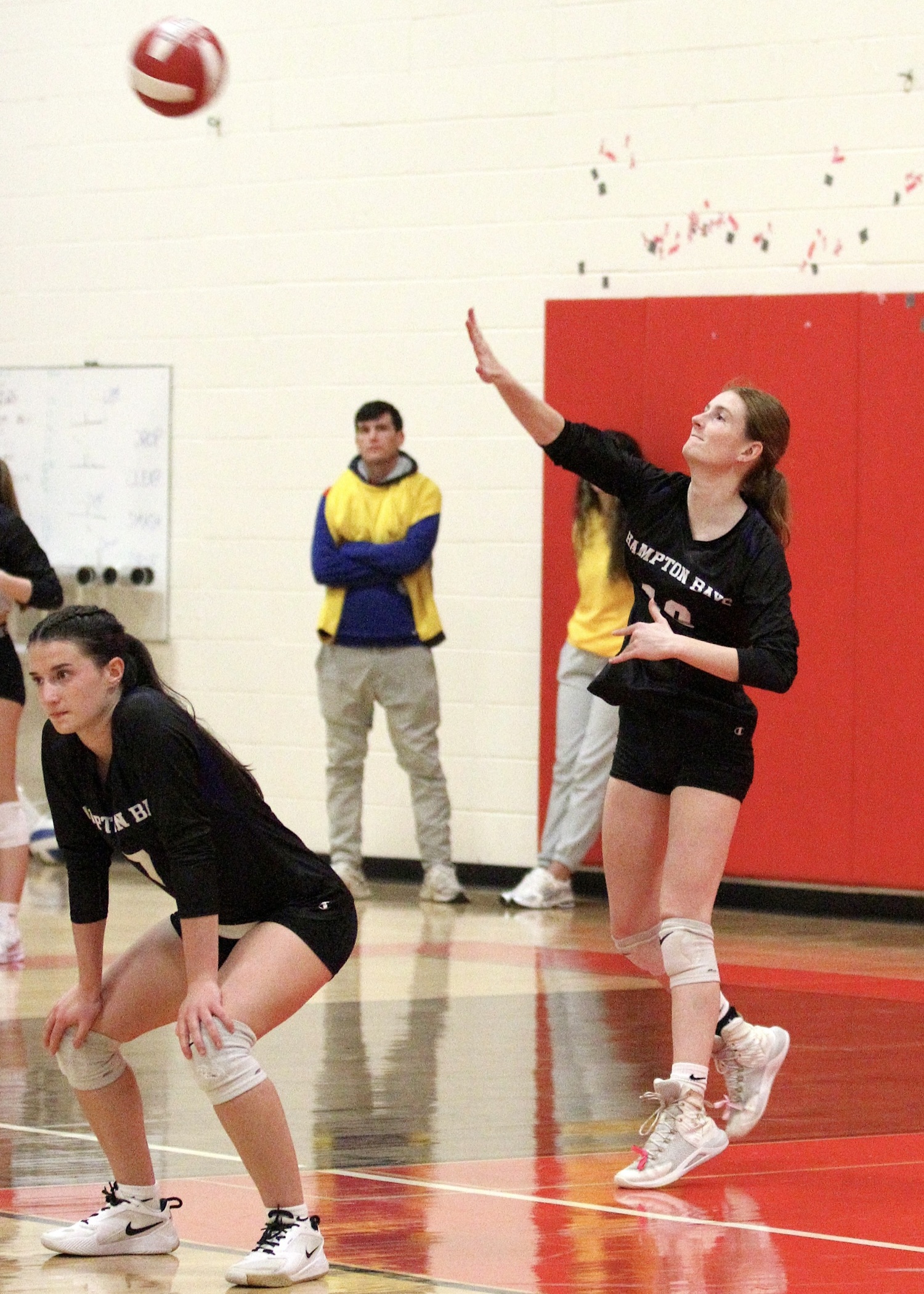 Senior middle blocker Shea Egan serves. DESIRÉE KEEGAN