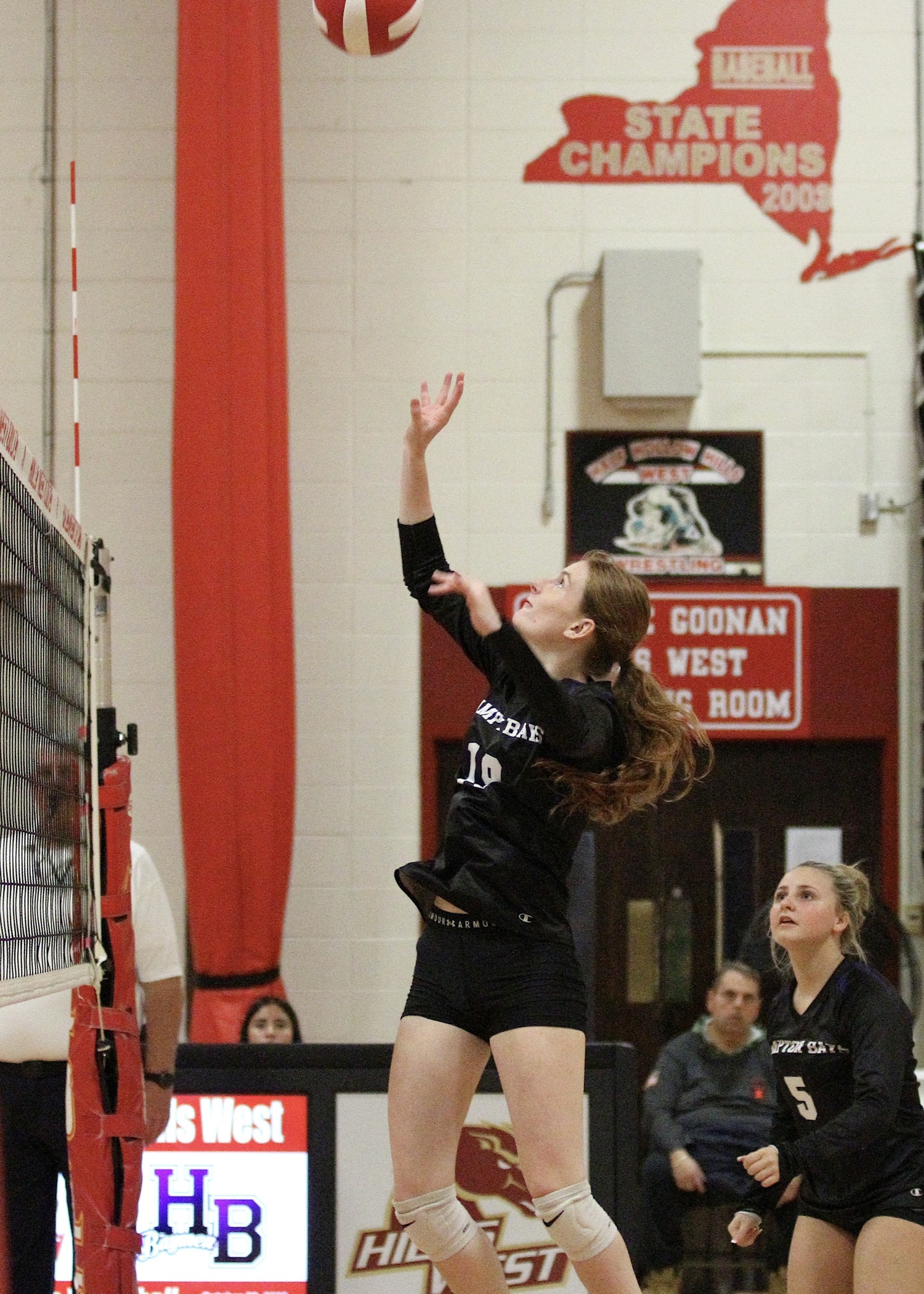 Senior middle blocker Shea Egan goes up for the ball. DESIRÉE KEEGAN