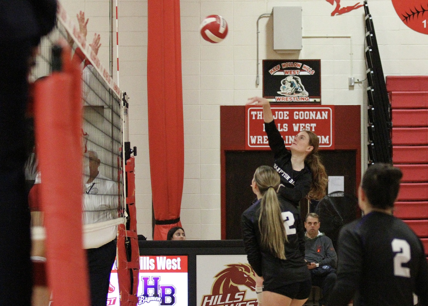 Senior middle blocker Shea Egan keeps the point alive. DESIRÉE KEEGAN