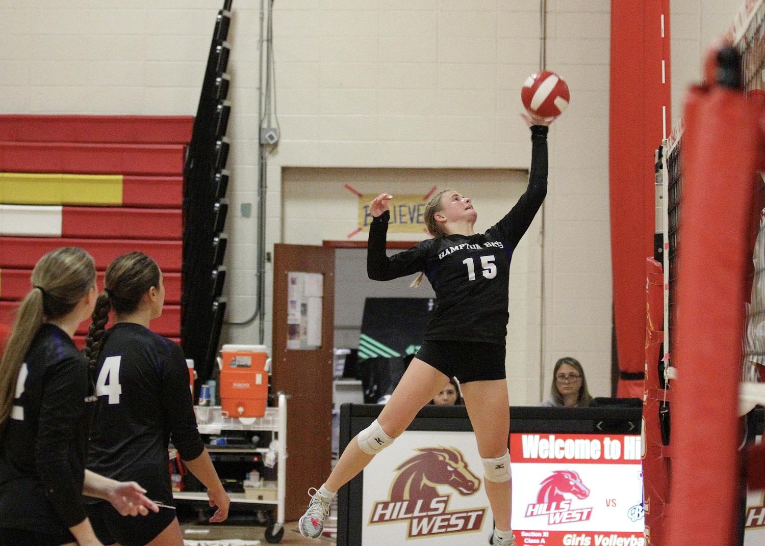 Senior outside hitter Taylor Meyers spikes the ball. DESIRÉE KEEGAN