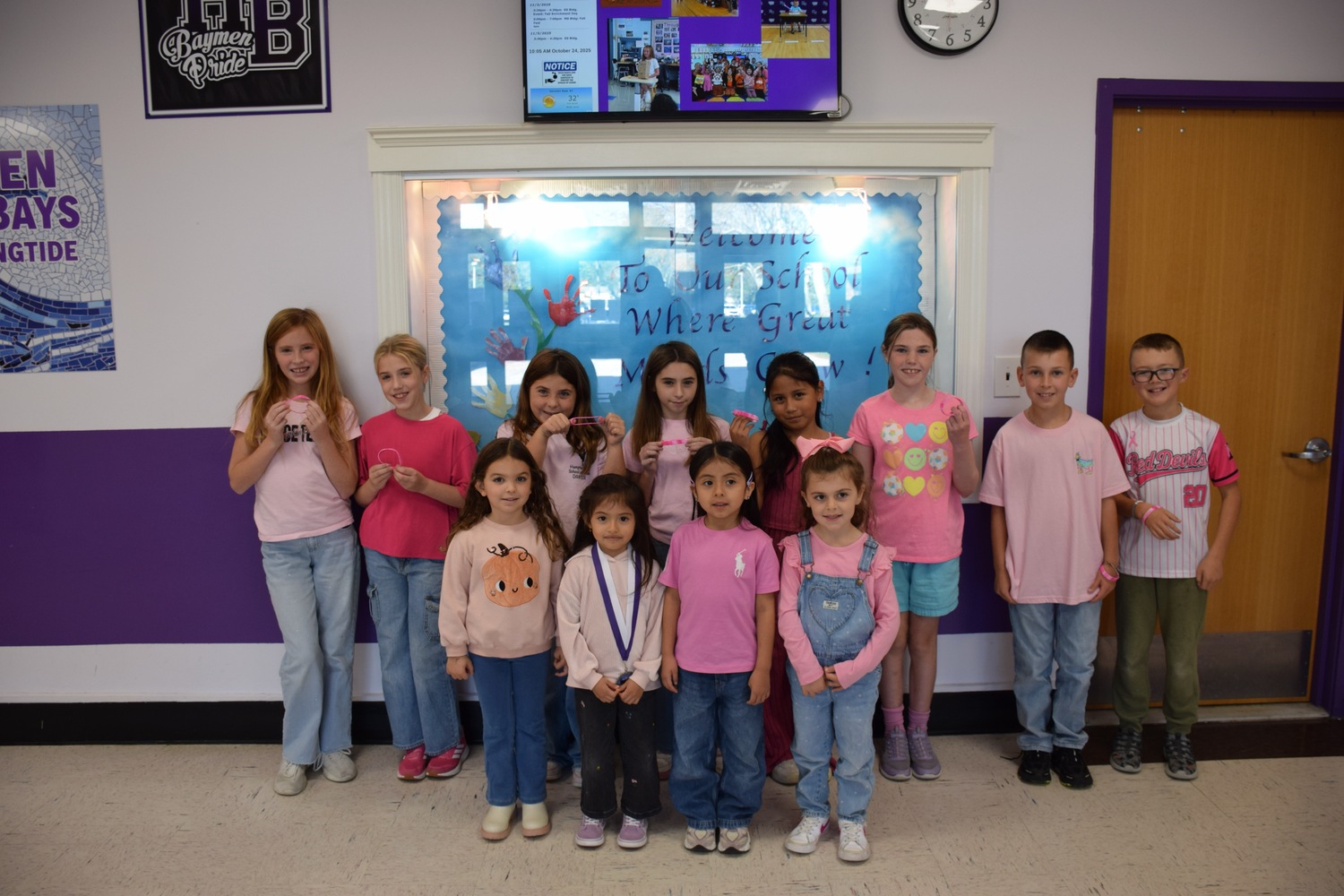 Members of the Hampton Bays Elementary School service organization K-Kids recently donated $300 to the American Cancer Society as part of their annual breast cancer awareness fundraiser. They raised the funds by selling breast cancer awareness bracelets to fellow students, teachers and administrators. Students and staff also wore pink on October 24 in honor of the cause. They will next aim to raise funds for the school’s annual holiday gift card drive by selling holiday squishies. COURTESY HAMPTON BAYS SCHOOL DISTRICT