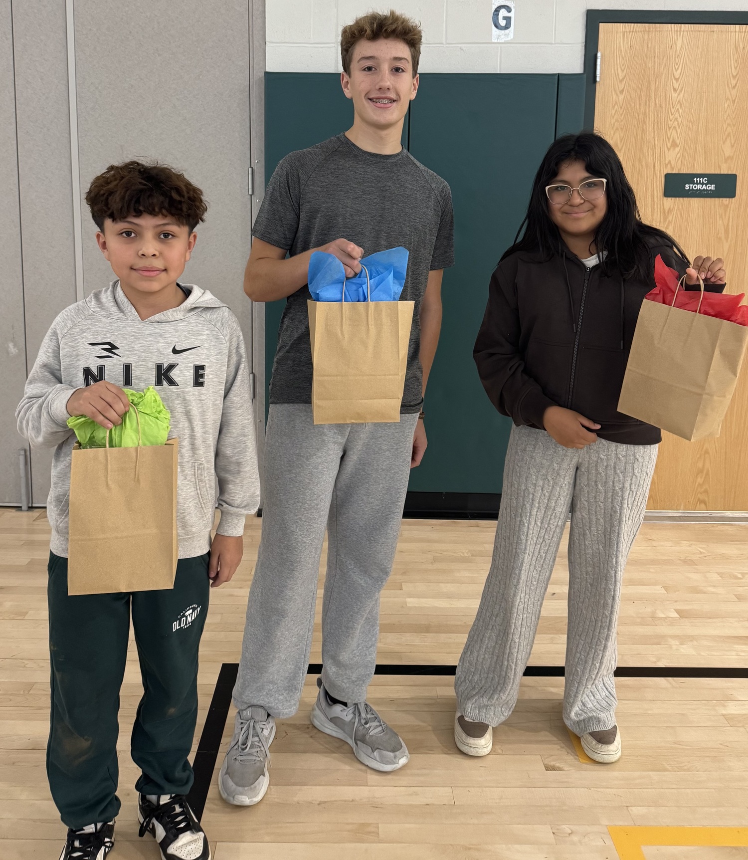 Middle school students with their kindness swag bags. DANIELLE HAMILTON