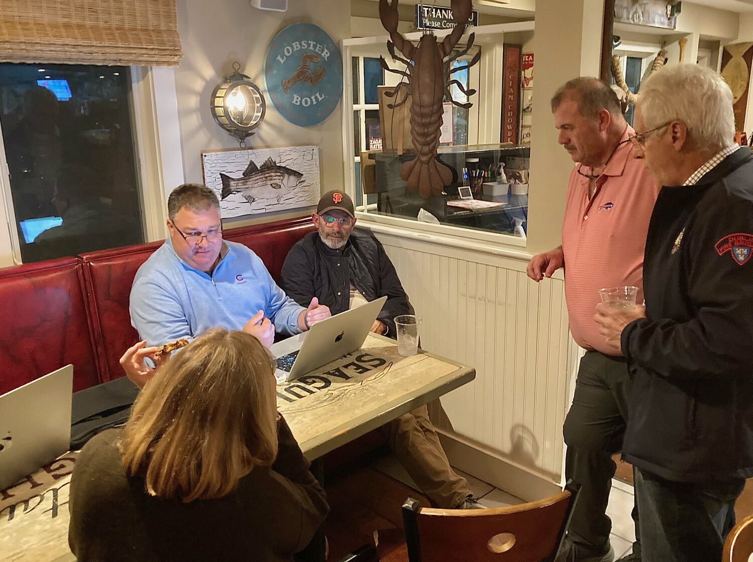 Republican Town Board candidate J.P. Foster, seated in blue, failed to win a seat on the Town Board, as Democrats swept elections in East Hampton. KYRIL BROMLEY