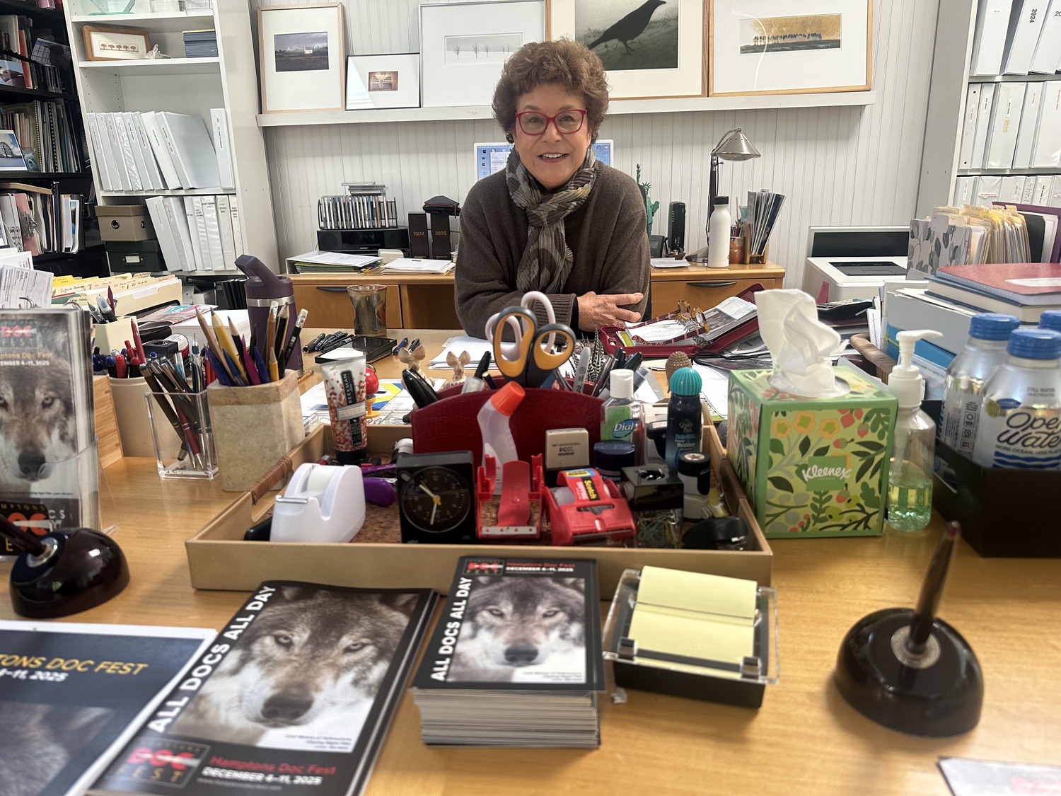 Jacqui Lofaro, founder of the Hamptons Doc Fest, hard at work in the festival's Bridgehampton headquarters. ANNETTE HINKLE