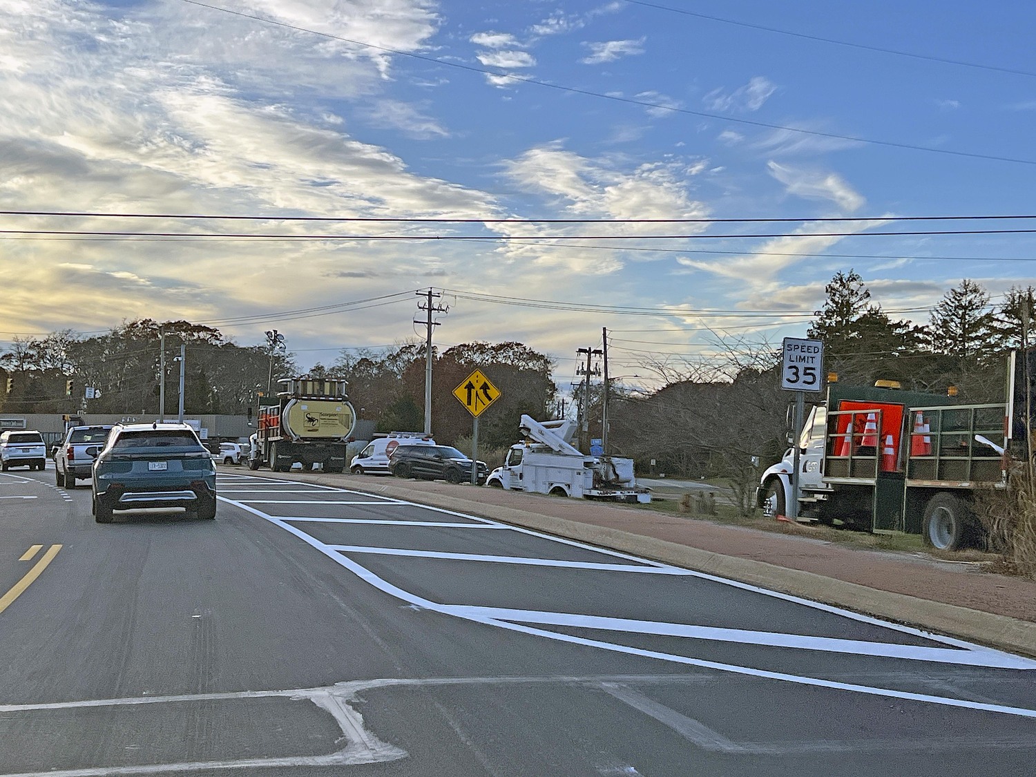 New traffic patterns on County Road 39 force cars to merge to one lane west of North Sea Road so that cars from Sandy Hollow Road can enter the roadway without a third red cycle to the traffic signal.  DANA SHAW