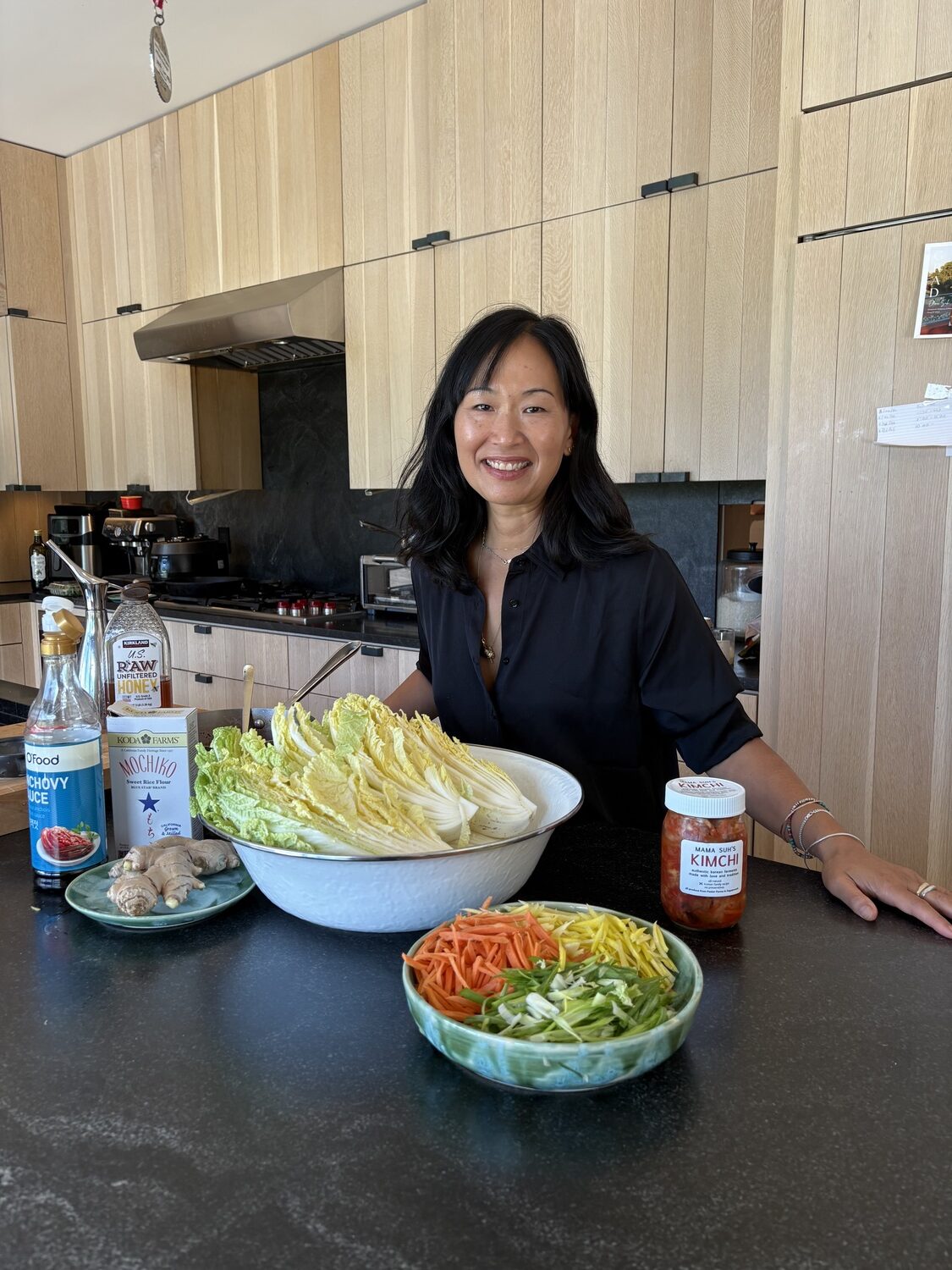 Shelley Suh at her home in Sagaponack. Her homemade kimchi is in high demand, and is currently sold at Marilee's Farmstand and the Sagaponack General Store. She uses vegetables grown at Marilee Foster's Sagaponack farm to make the kimchi. CAILIN RILEY PHOTOS