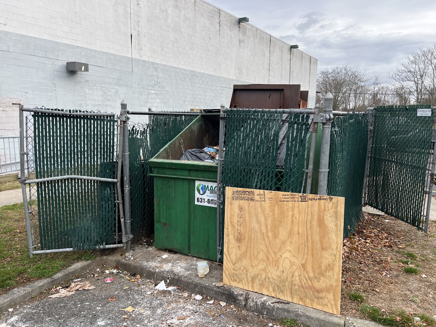 One of the laborers, an undocumented immigrant, hid from ICE agents in a garbage enclosure, from which he witnessed the federal agents apprehend several others. DANA SHAW