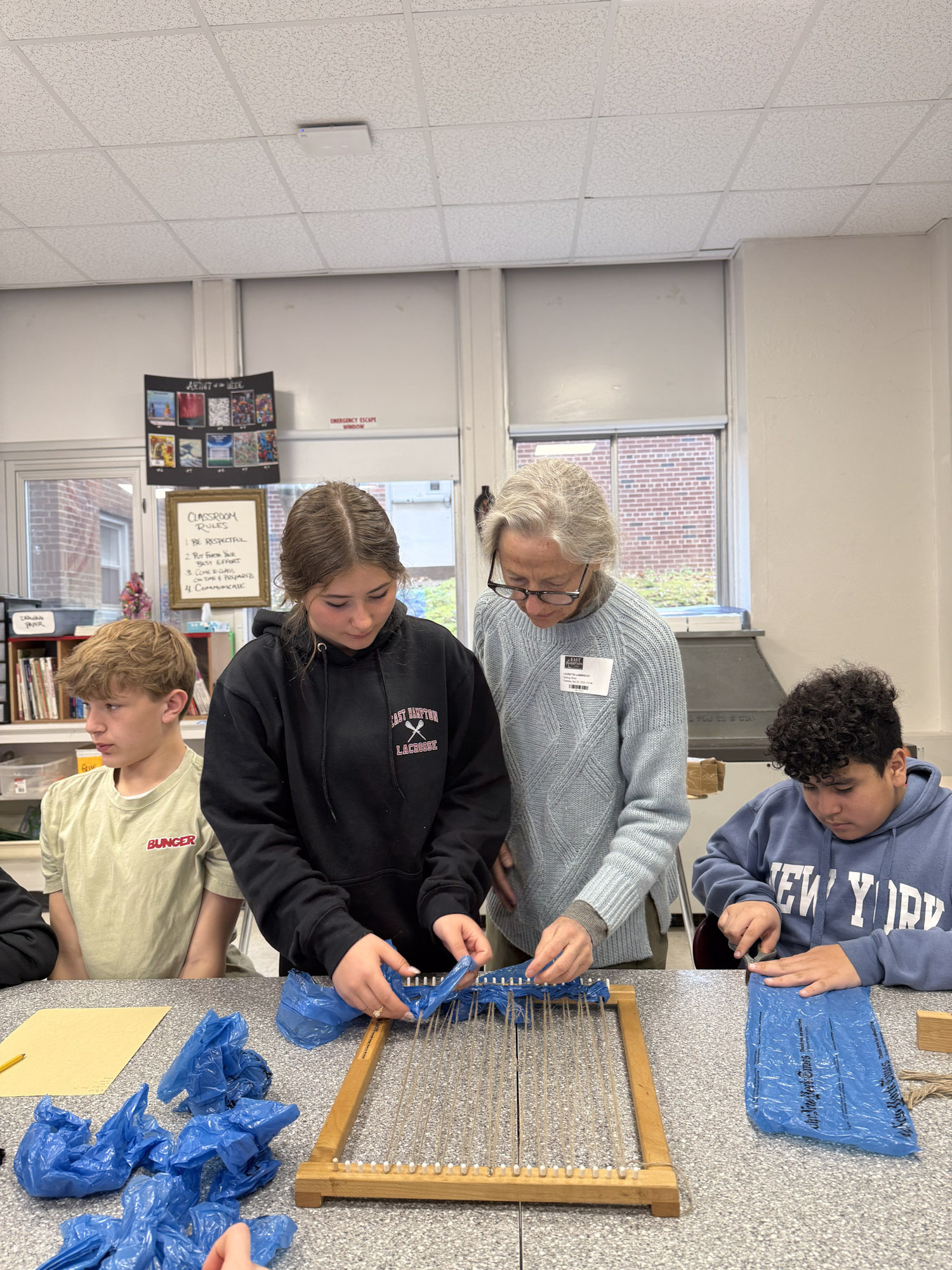 East Hampton Middle School students working with Laurie Lambrecht for the Student Art Festival. KAYLA MATTERS