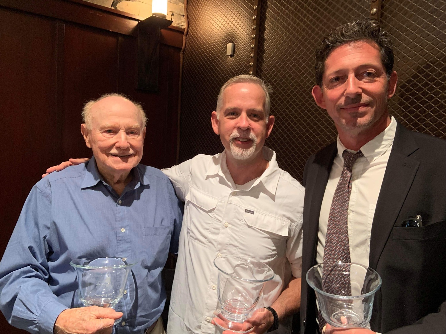 World War II veteran Martin Sylvester, a Springs resident, with USA Warrior Stories creators Matt Hindra, center, and Nick Kraus, right.