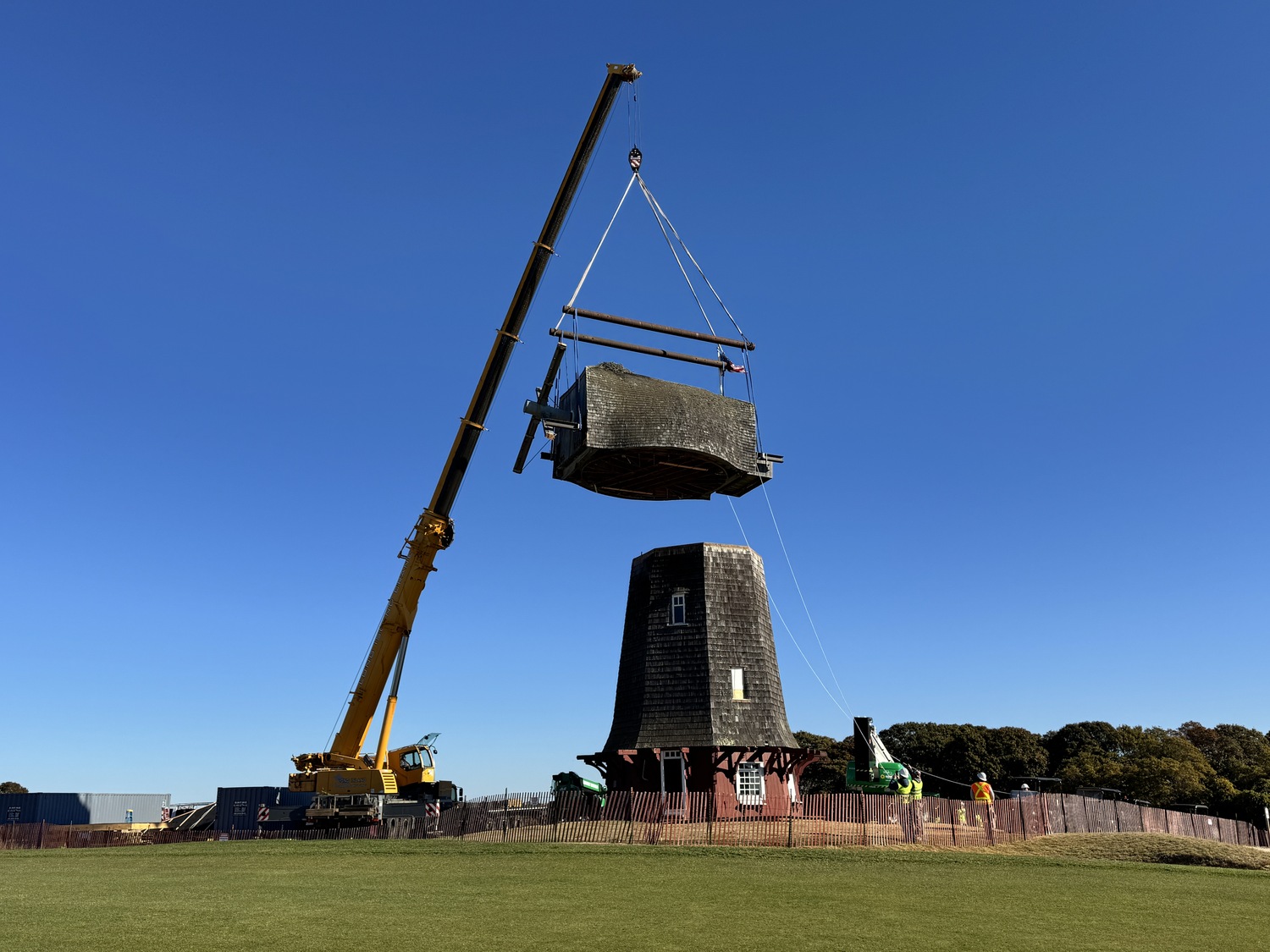 An industrial crane was used to lift the cap off the tower intact. MICHAEL WRIGHT