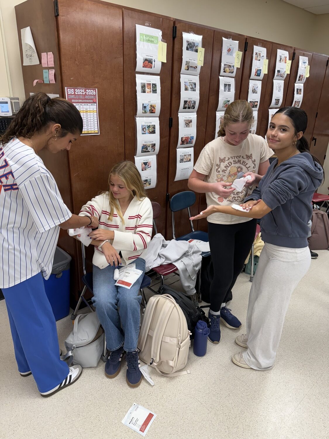 Southampton Intermediate School eighth grade home and career students, including from left, Cameryn Mambrino, Peyton Hull, Katherin Dupree, Lia Gonzalez, recently received hands-on training in CPR and first aid thanks to a partnership with the Southampton Village Volunteer Ambulance Company. During the engaging and interactive sessions, the students learned essential lifesaving techniques, including how to perform CPR, treat minor injuries and respond in emergency situations until professional help arrives. Members of the ambulance company also demonstrated proper procedures, answered questions and shared real-life experiences from their work in emergency response. COURTESY SOUTHAMPTON SCHOOL DISTRICT