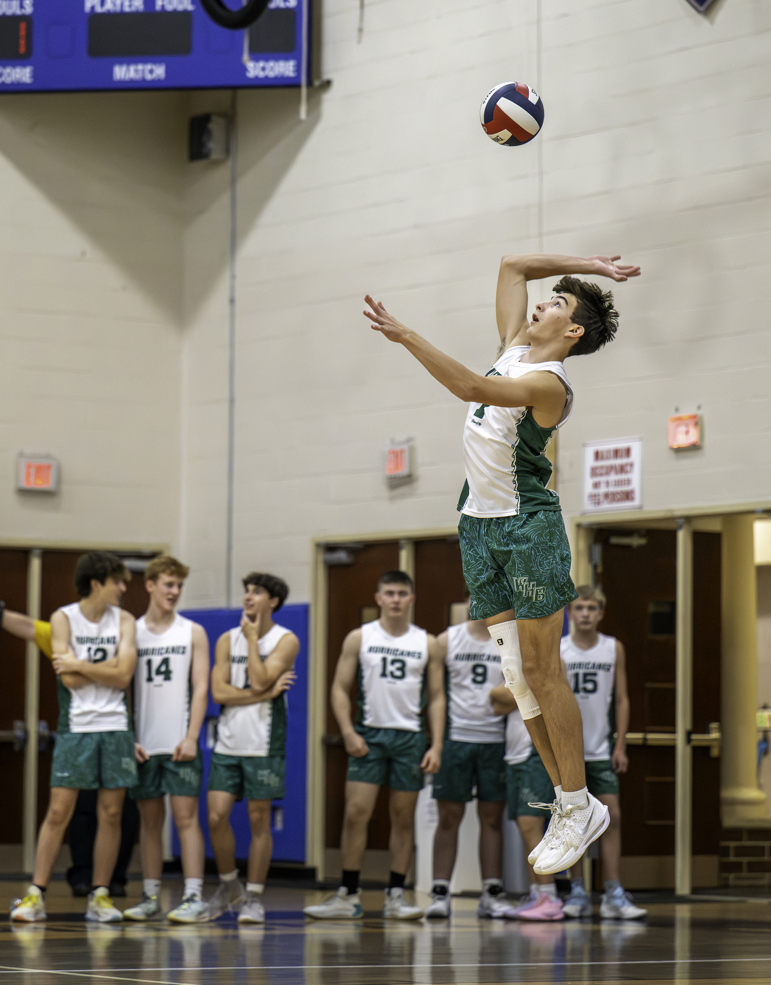 Junior outside hitter Gabe Monserrate serves. MARIANNE BARNETT