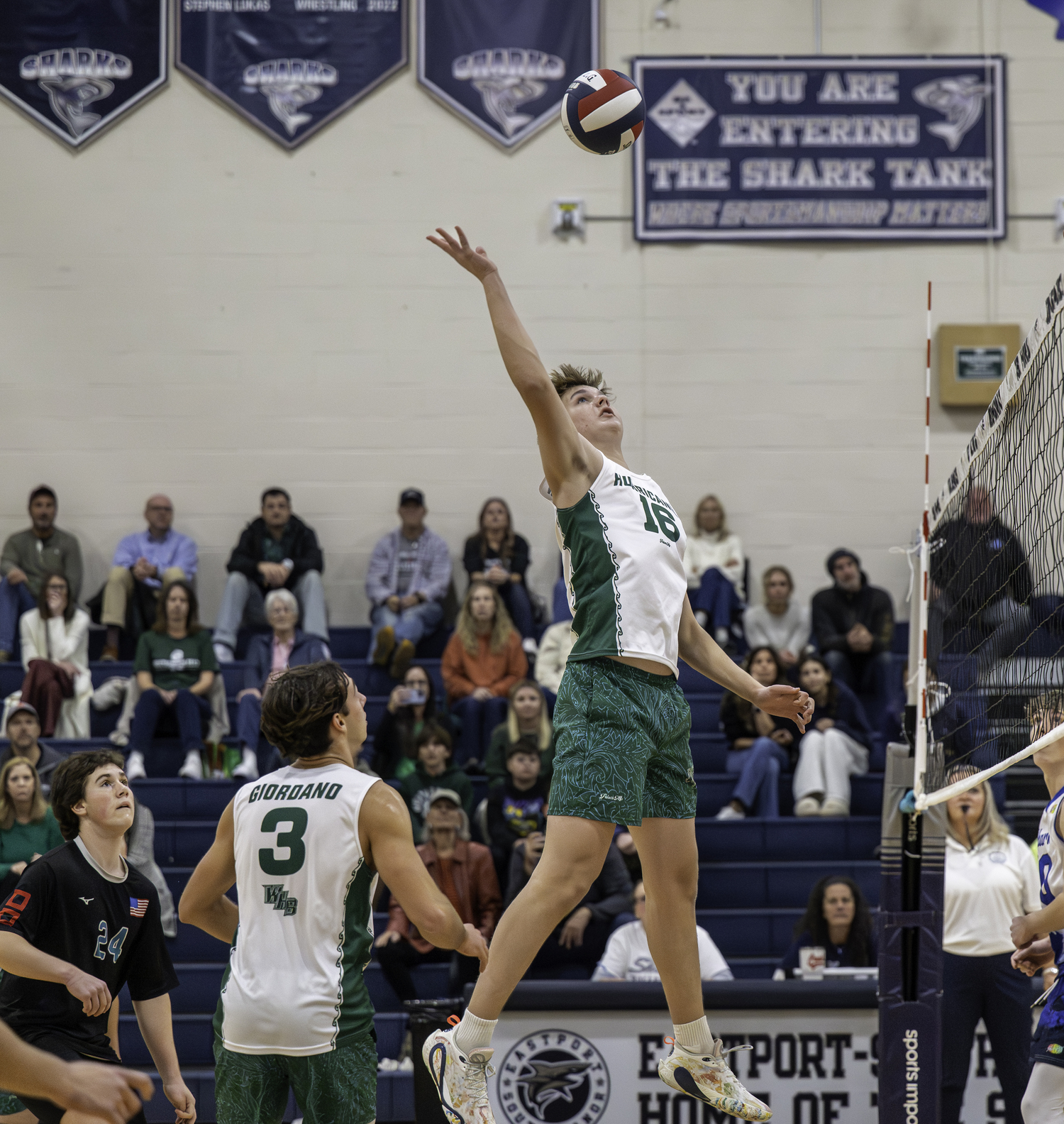 Sophomore middle hitter Luca Caumartin reaches for the ball. MARIANNE BARNETT