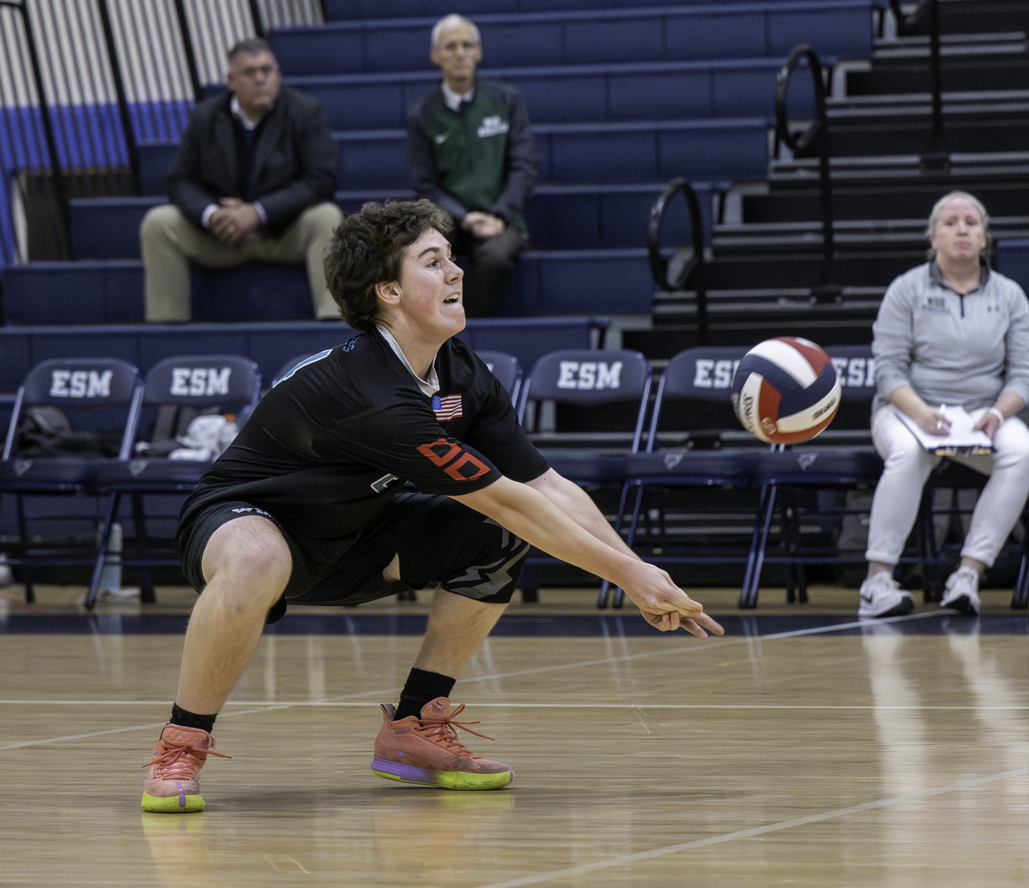 Junior libero Nolan Parsons reaches for the ball. MARIANNE BARNETT