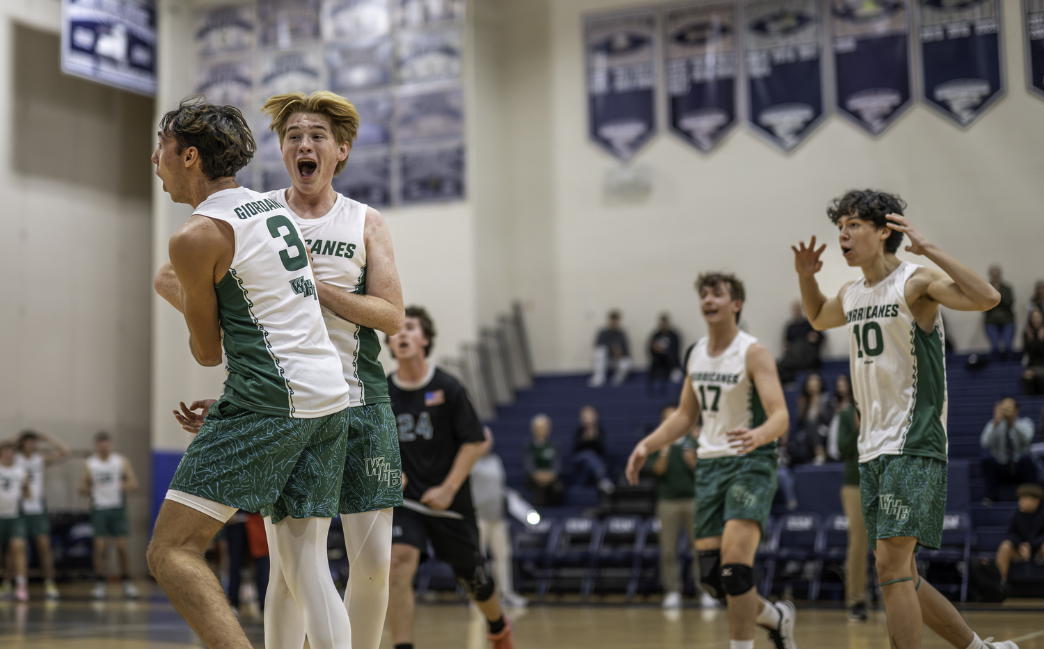 Senior setter Cameron Giordano and junior setter Grayden Scott celebrate a point. MARIANNE BARNETT