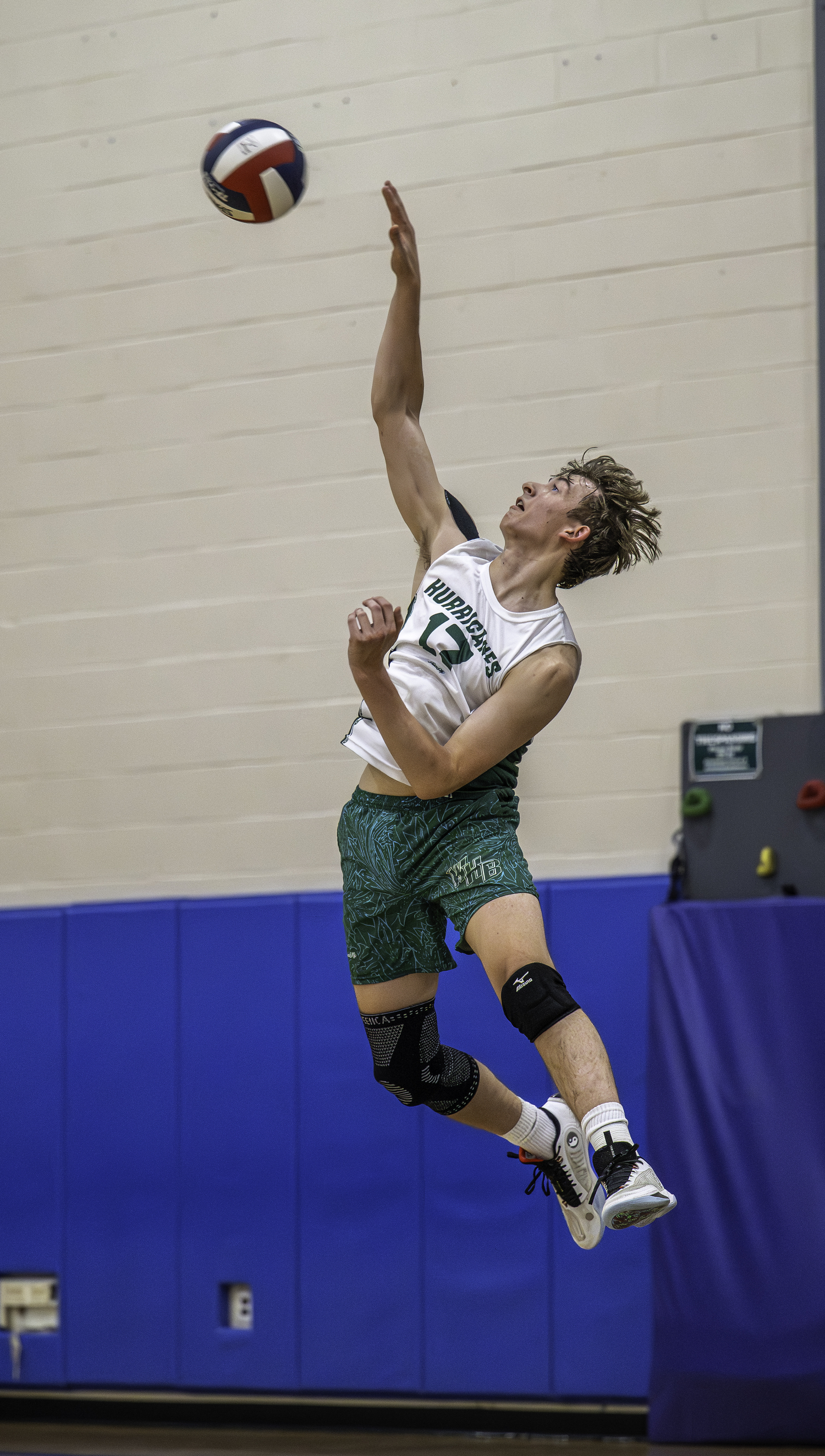 Senior outside hitter Thomas Livia serves. MARIANNE BARNETT