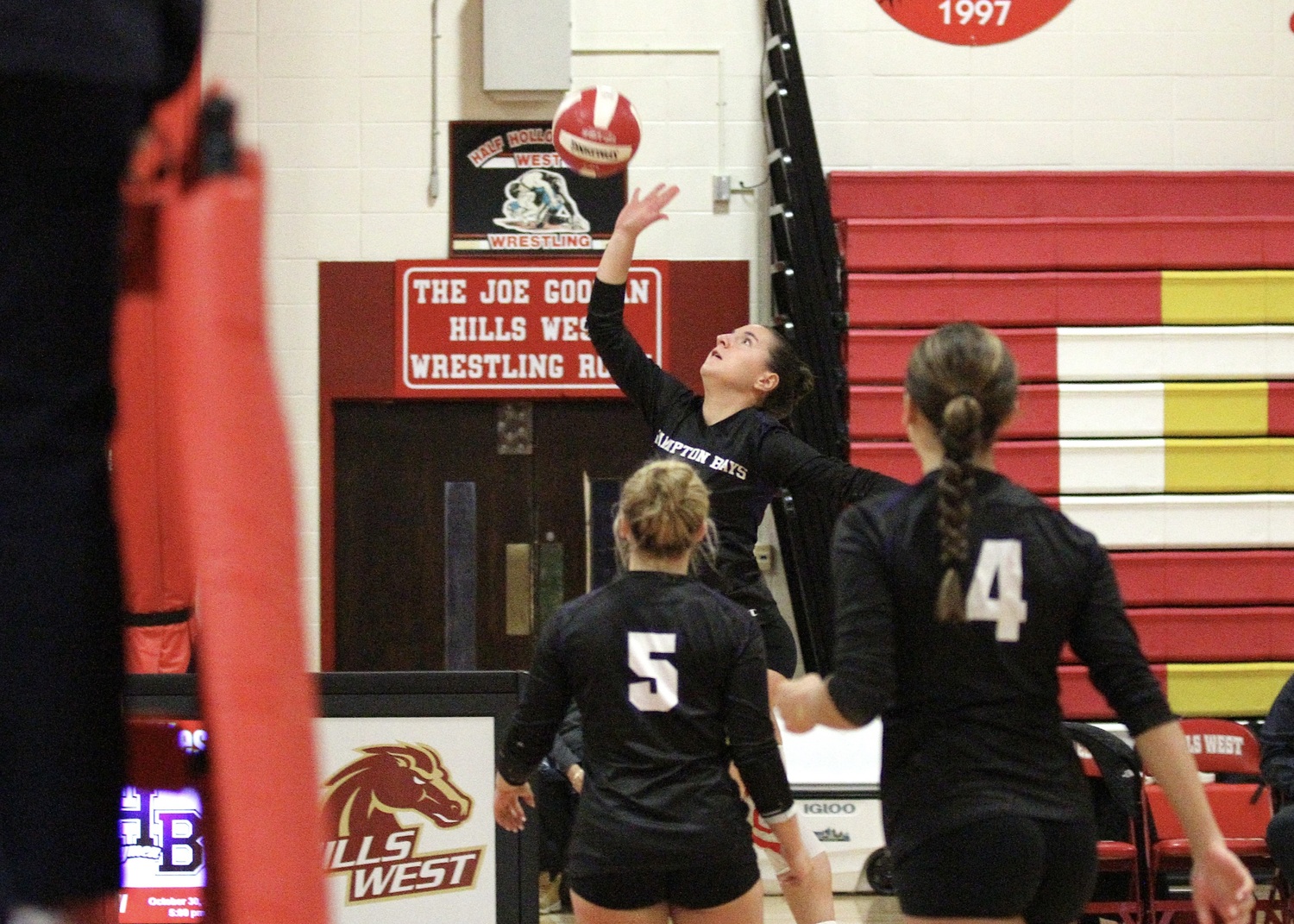 Senior outside hitter Madysen Frederiksen hits the ball over the net. DESIRÉE KEEGAN