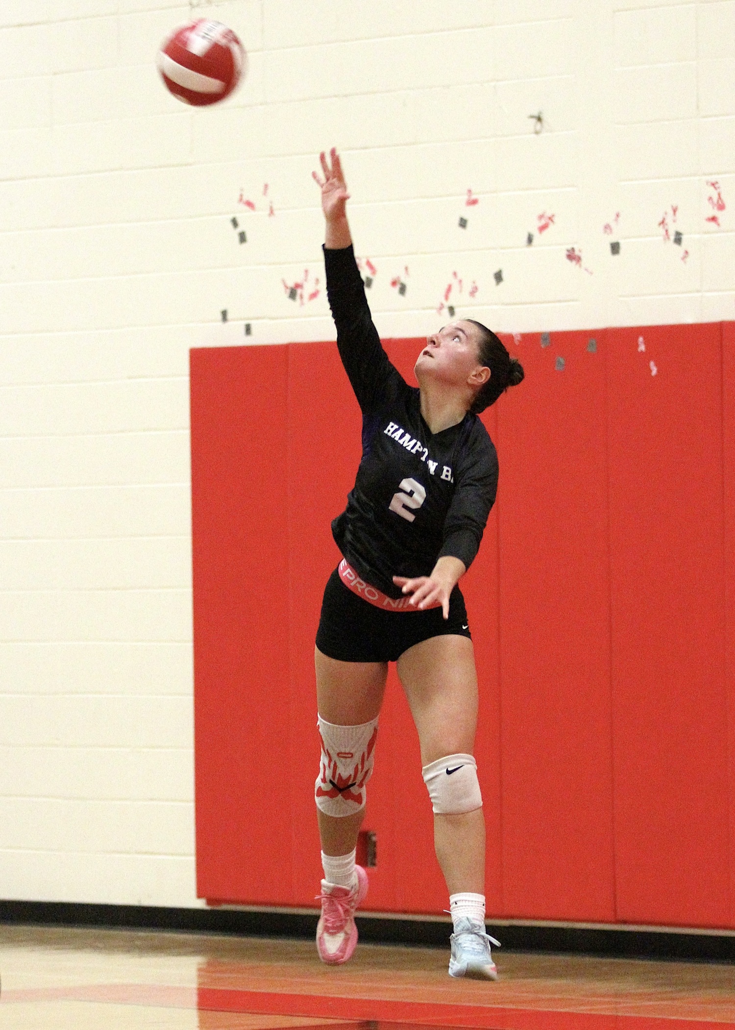 Senior outside hitter Madysen Frederiksen serves. DESIRÉE KEEGAN
