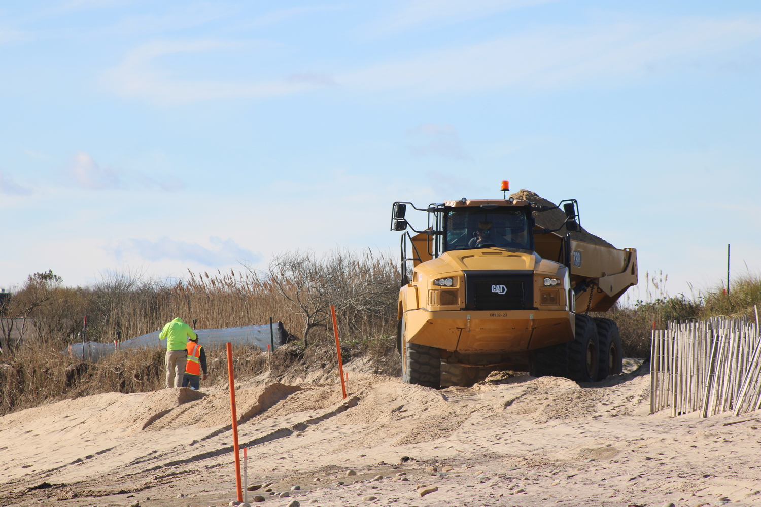 The Ditch Plains dune reconstruction project got underway in Montauk last week. This is the second of a two phase project intended to fortify the area against storms and climate change. JACK MOTZ
