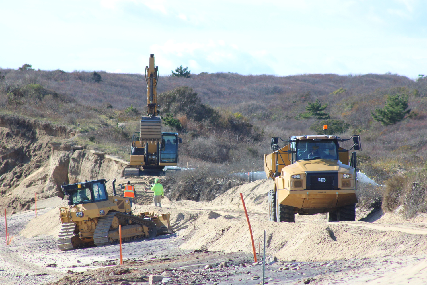 The transport truck drives on a sandy road back to the parking lot, where it would grab more sand, which it would then bring out onto the beach. JACK MOTZ